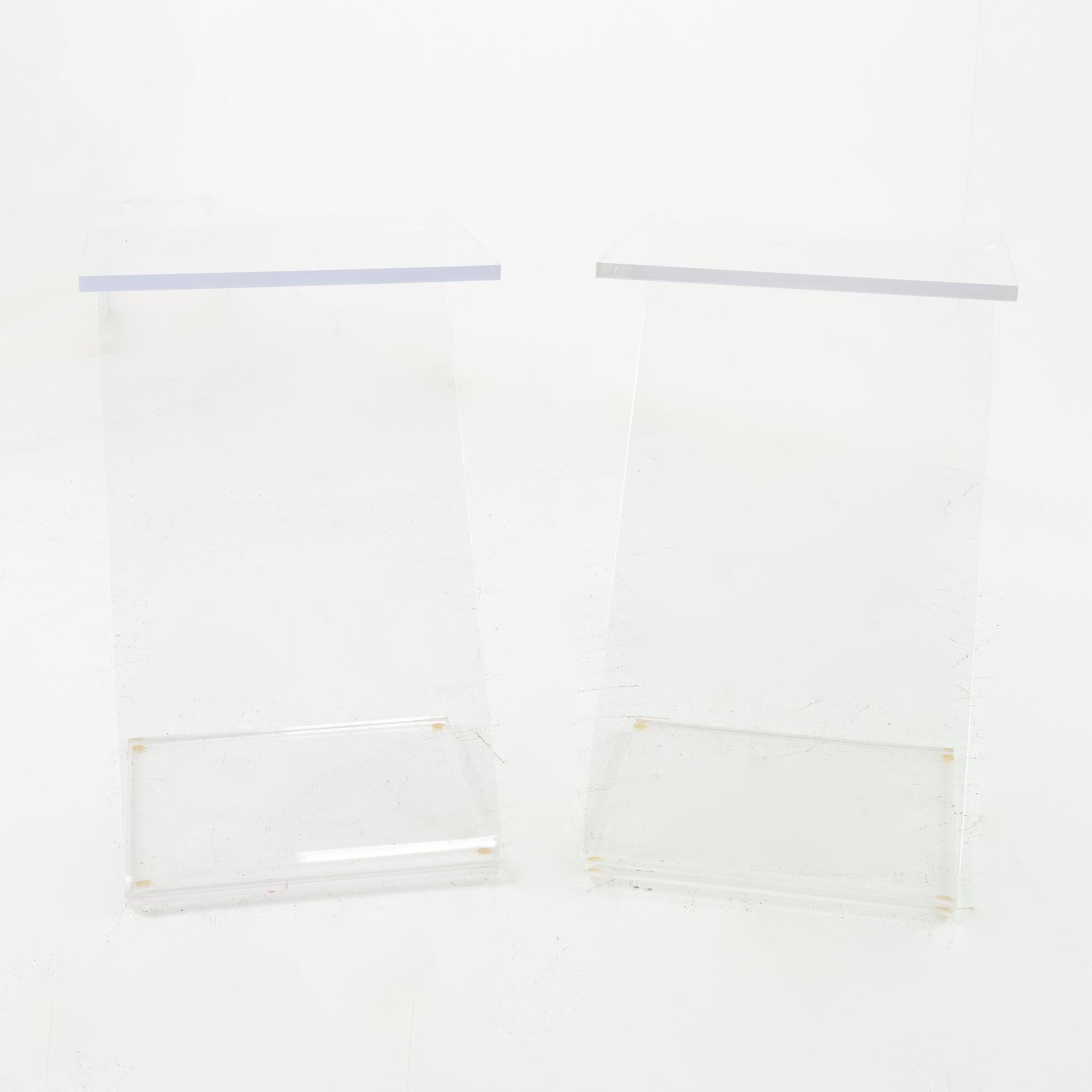 Midcentury Lucite Z-shaped side end tables, matching pair
Measures: 13 wide x 13.25 deep x 22 inches high

Each piece of furniture is available in what we call restored vintage condition. Upon purchase it is thoroughly cleaned and minor repairs