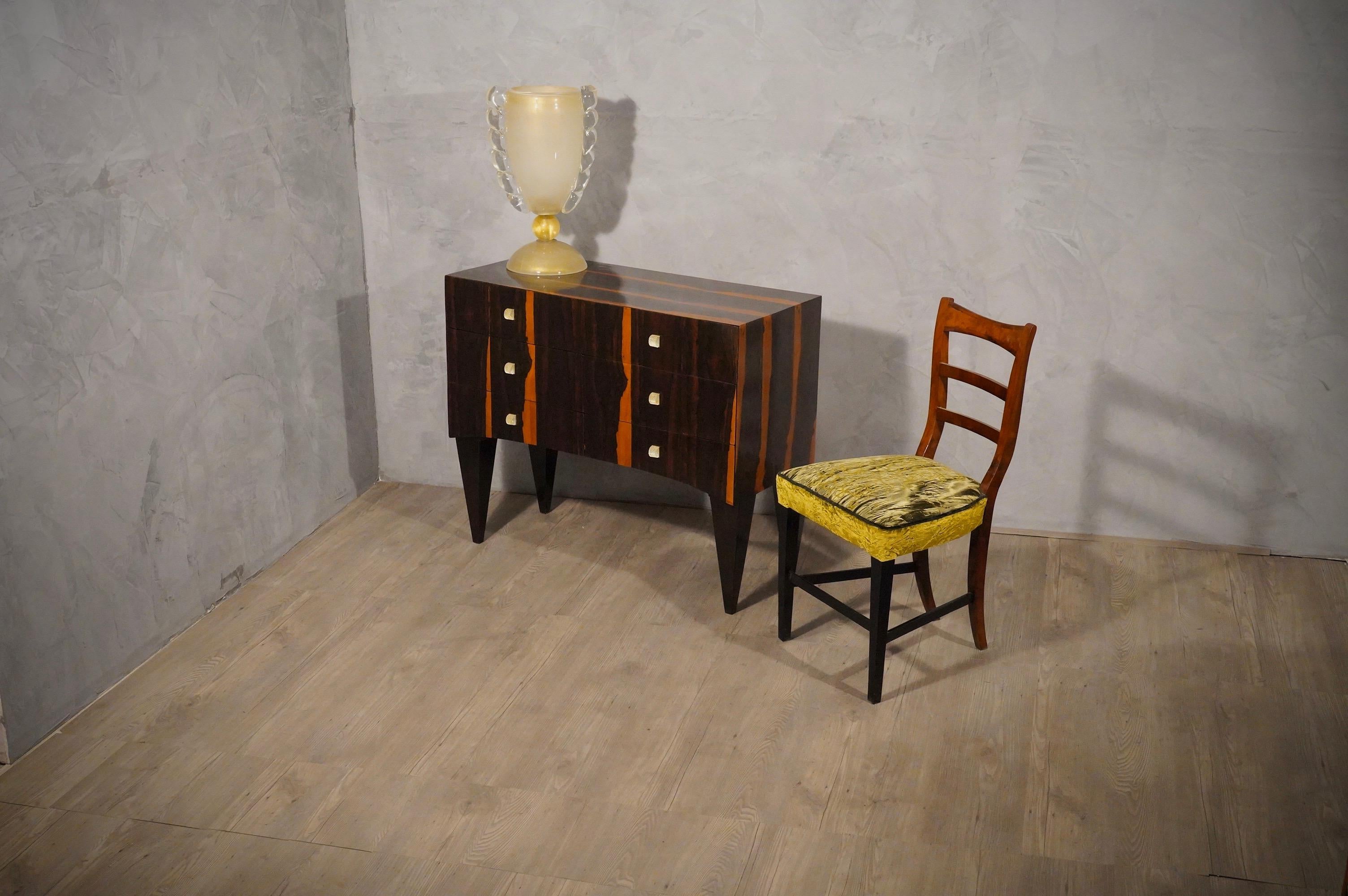 Glamor and precious dresser, due to the choice of refined materials, and a pleasant patina emphasizes the grain of the Macassar wood and makes the dresser elegant and unique.

The chest of drawers is veneered in Macassar wood; there are five