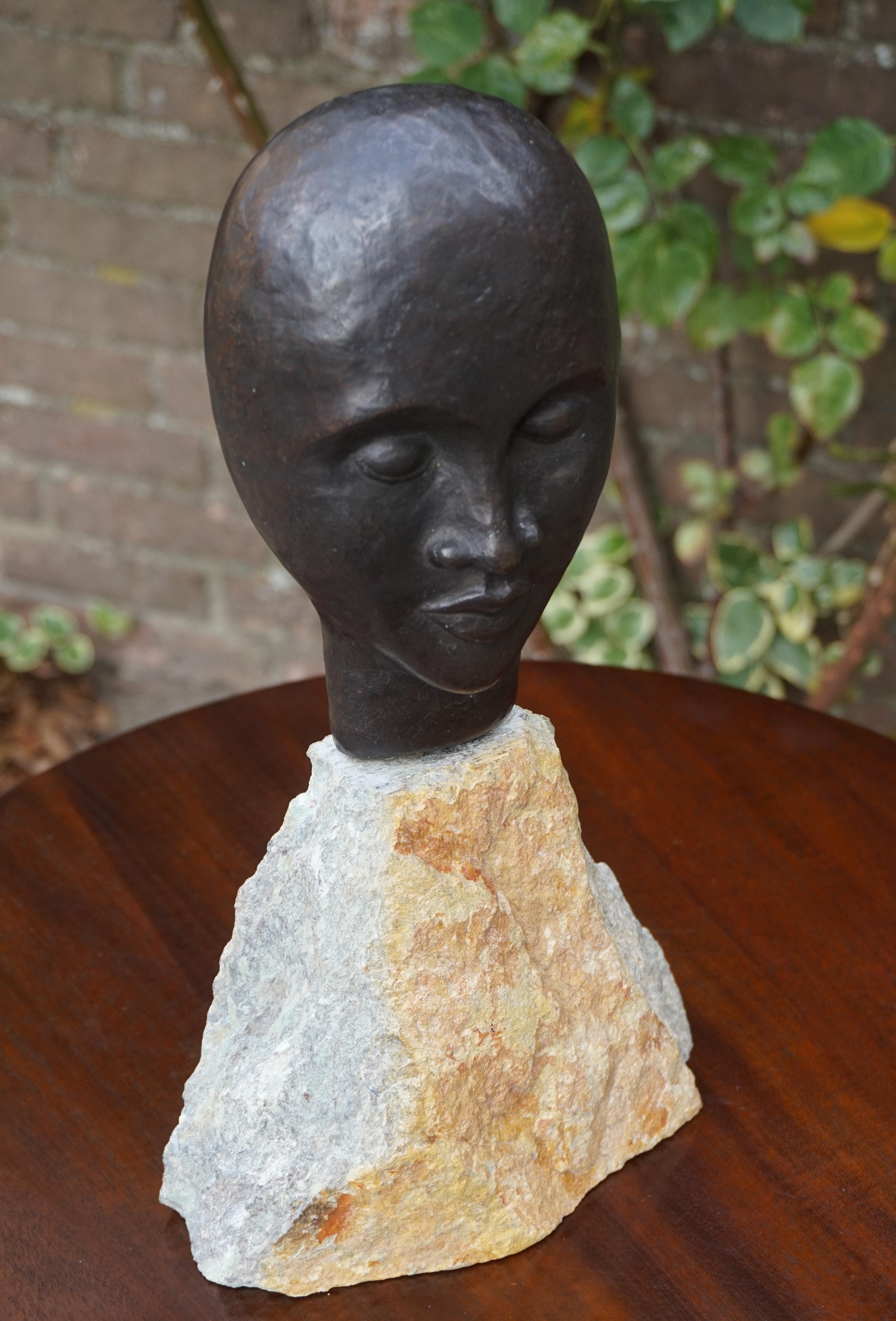 Hand-Crafted Midcentury Made Bronze Sculpture of a Serene African Male on a Limestone Base For Sale