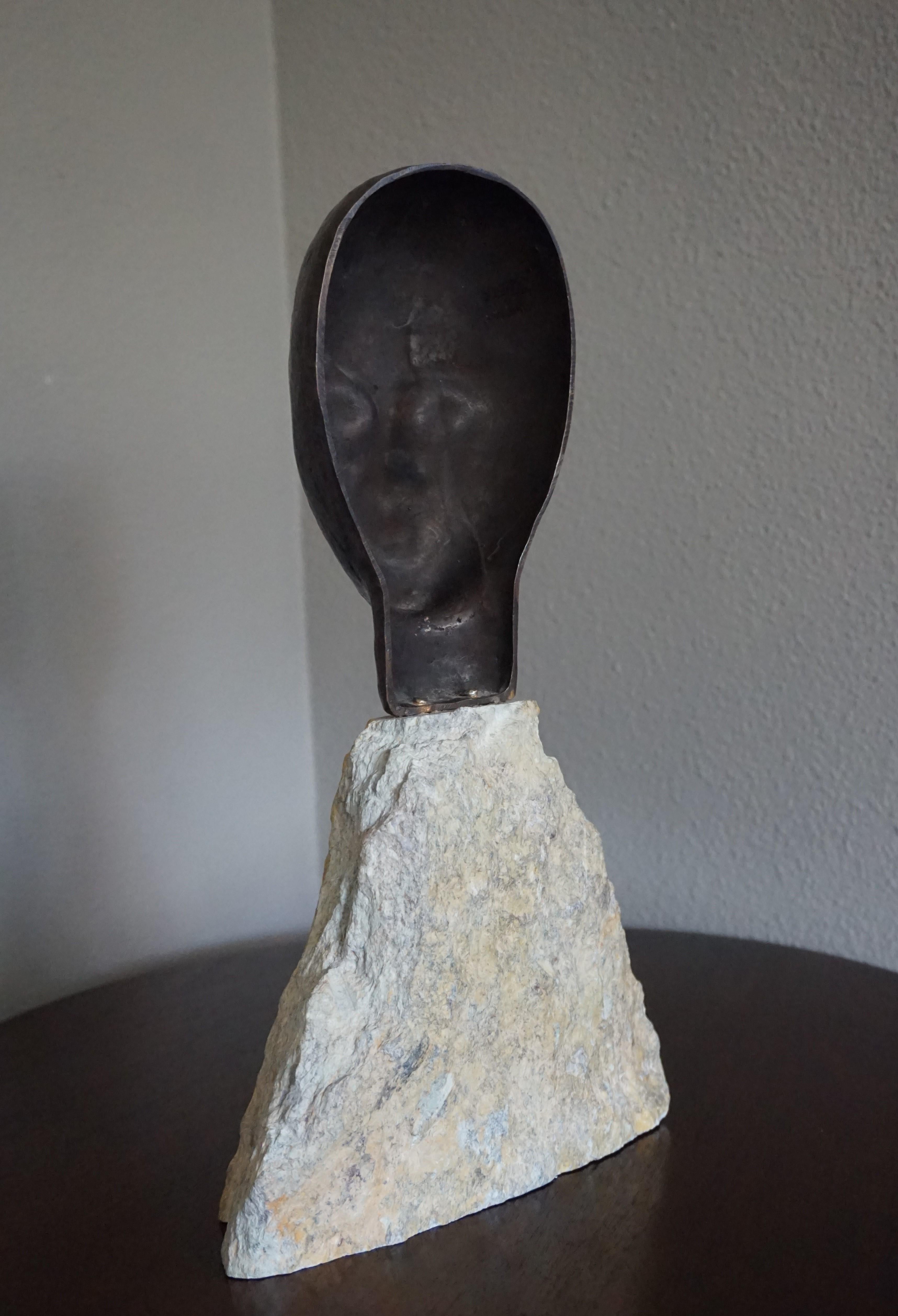 20th Century Midcentury Made Bronze Sculpture of a Serene African Male on a Limestone Base For Sale