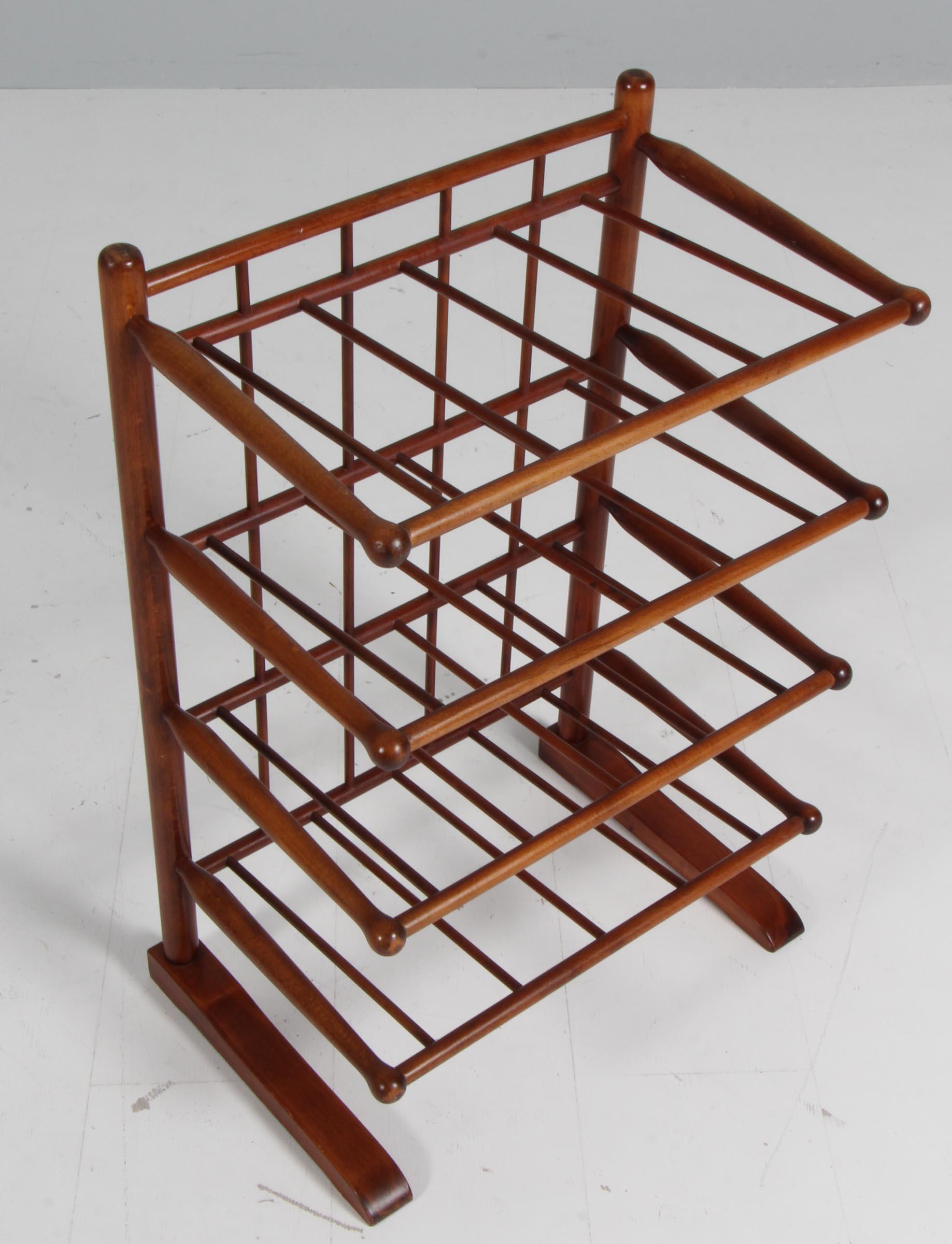Magazine or shoe rack designed by Frits Henningsen and manufactured by Andreas Tuck in Denmark during the 1940s. The solid mahogany frame features Drumstick detailing and bend/shaped wood detailing.

