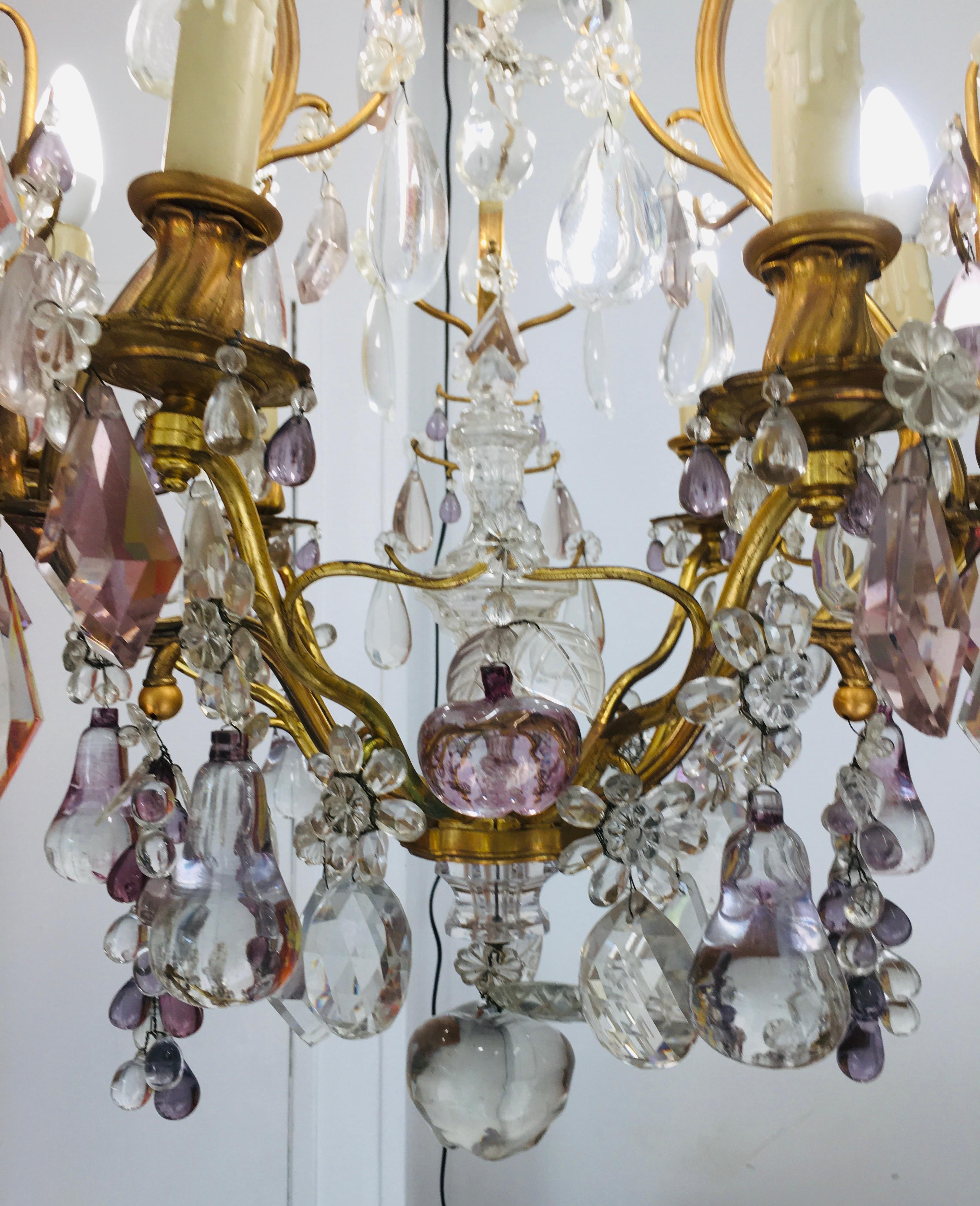 very unic and elegant French Maison Bagues bronze and glass Chandelier.
Glass Fruits, flowers and geometric cristal on a gilded bronze frame.
Six lights which give a somptuous lightening.
Great design the symbols of excellence created since 1840