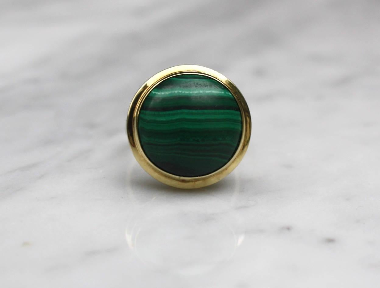 Beautiful vintage circa 1960s 14K gold malachite ring. In very good condition. Size 6.75 and resizable by a jeweler. Marked as 585, 14K. Stone measures 16mm in diameter, 16 carats. 
