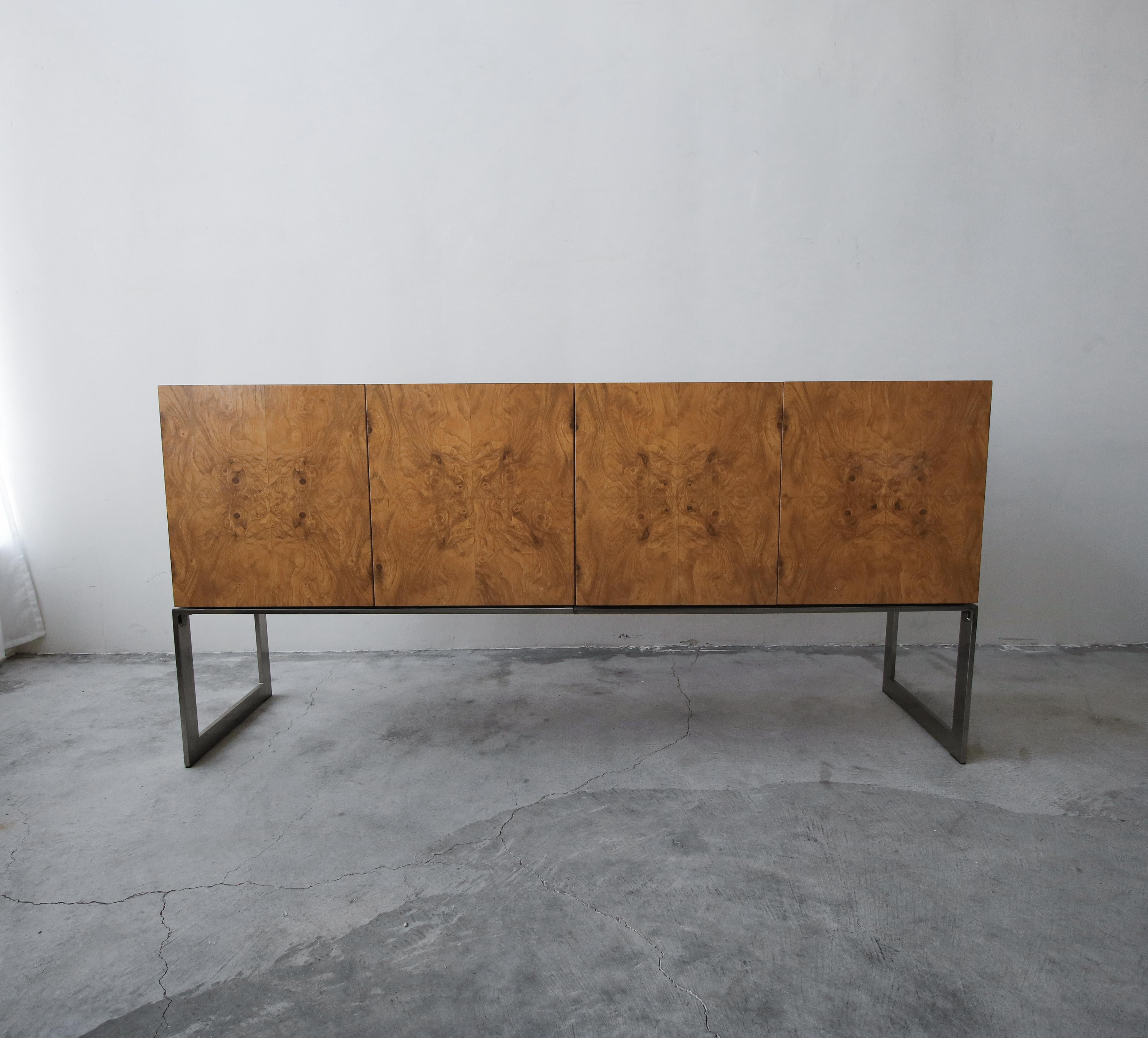 Stunning maple burl credenza on a chrome base designed by Milo Baughman for Thayer Coggin. A beautiful credenza, with beautiful book-matched grain.

The credenza is in excellent condition overall, the exterior has no imperfections to be noted. The