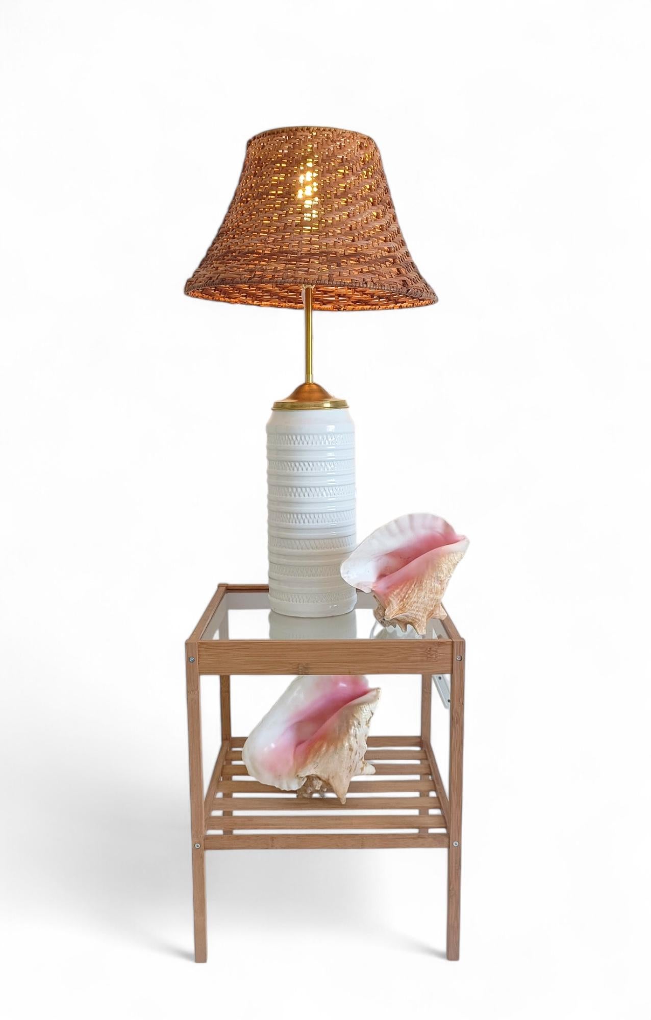 Ceramic Table Lamp with Carstens Tönnieshof Base, Brass Detail, and Wicker Shade

A refined table lamp composed of high-quality vintage elements, newly assembled with attention to detail and functionality. The base is a vintage West German ceramic