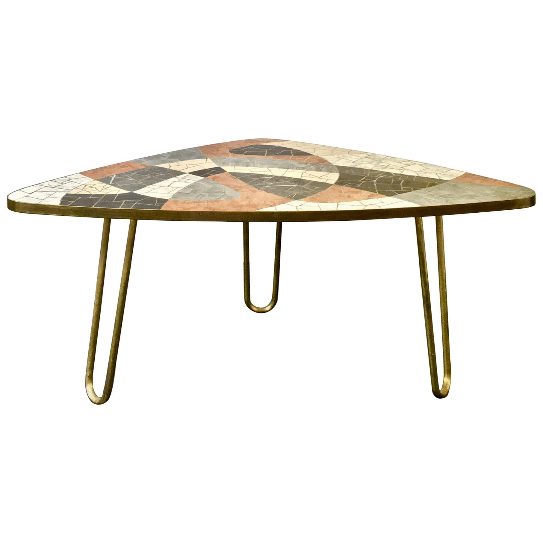 *** Please contact us for availability of this piece. ***

Midcentury coffee table of large-scale marble mosaic in an abstract design, Germany.

A stylish piece; the top has a soft curvilinear form, with mosaic in neutral tones of white, beige,