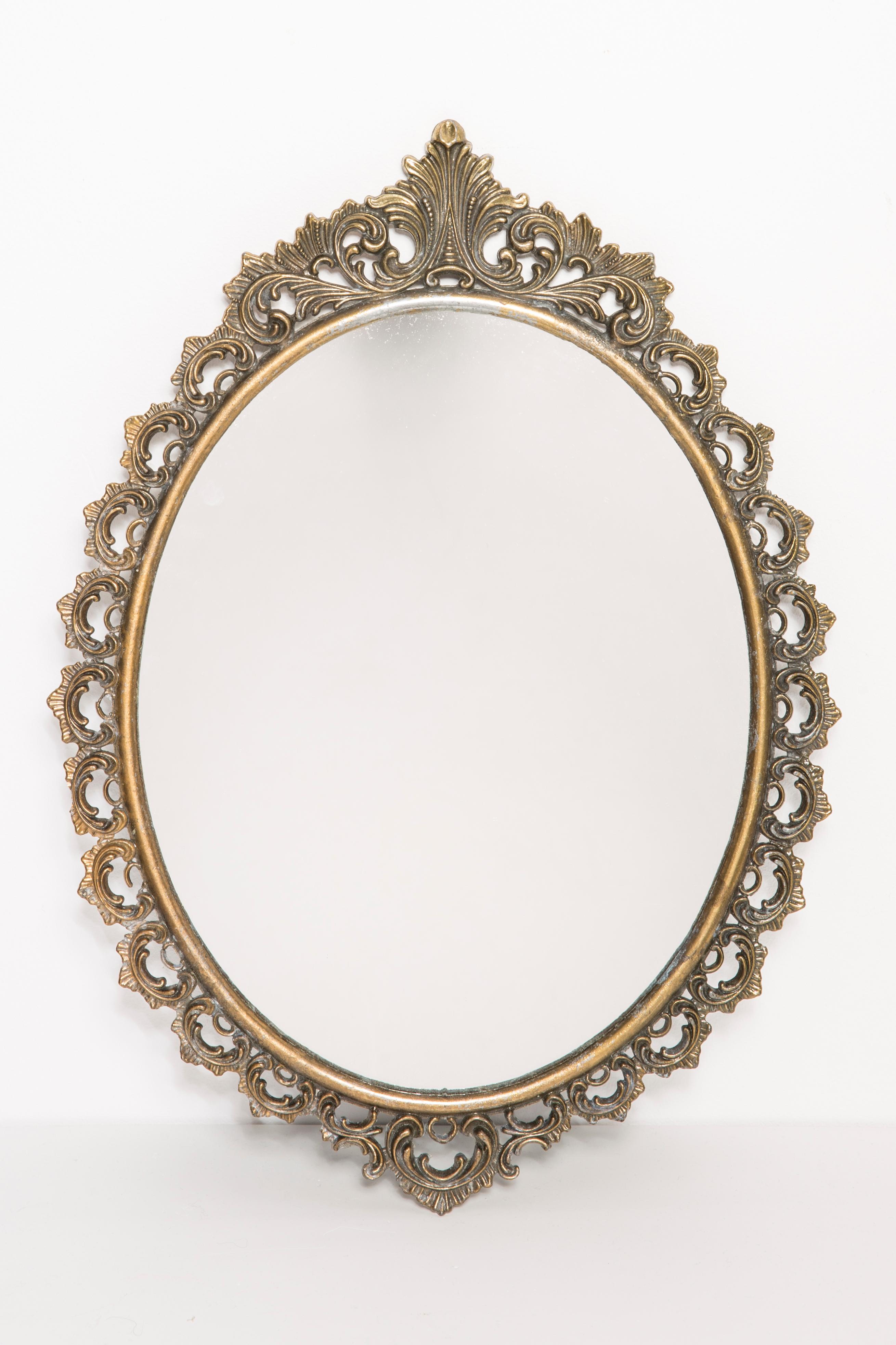 A mirror in a dark golden decorative frame from Italy. The frame is made of metal. Mirror is in very good vintage condition, no damage or cracks in the frame. Original glass. Beautiful piece for every interior! Only one unique piece.