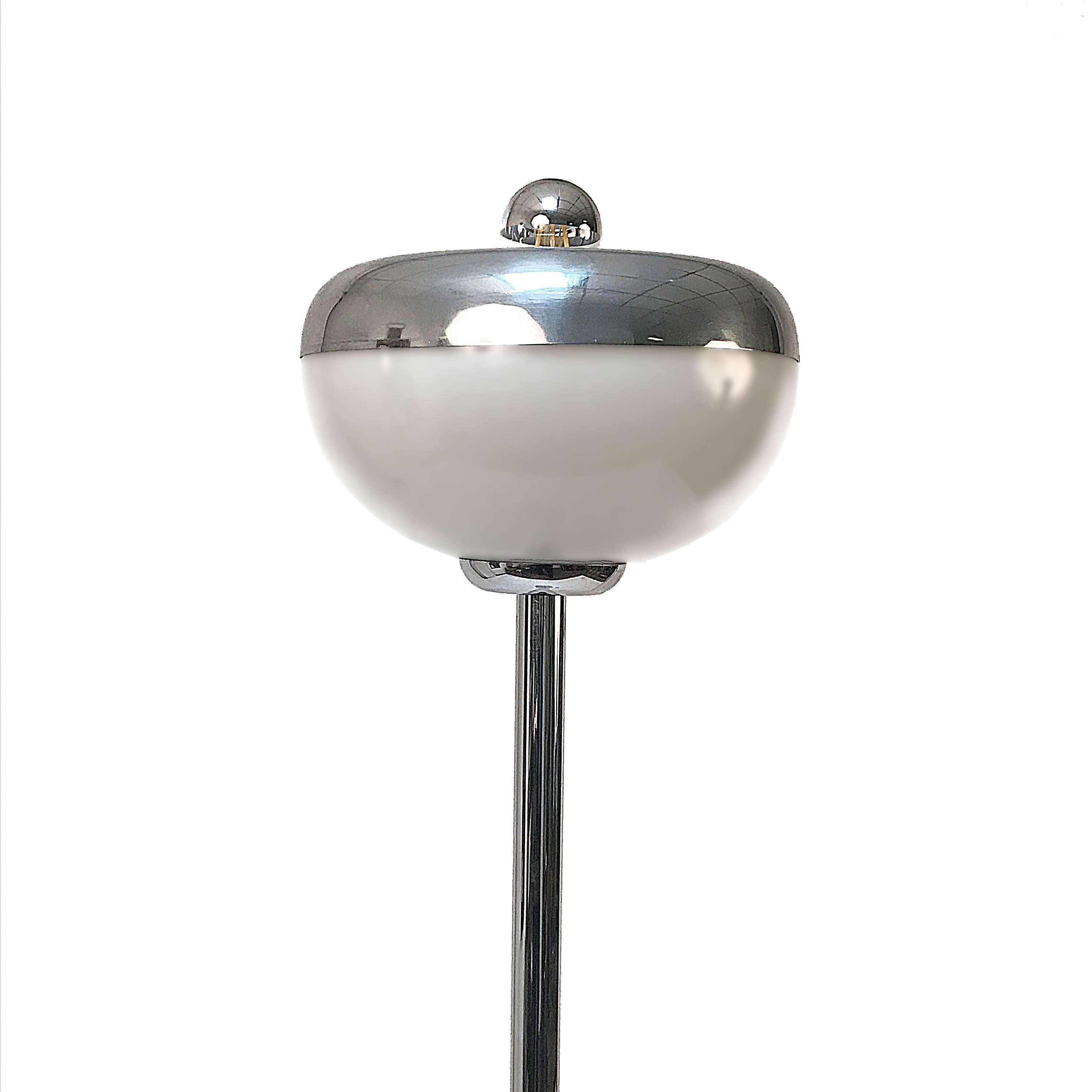 Double-start floor lamp in chromed metal, glass, and aluminium. 

It has a wonderful Carrara marble base produced in Italy during 70s. A piece where echoes of space-age design and materials (chromed metal and aluminium) meet the most classical of
