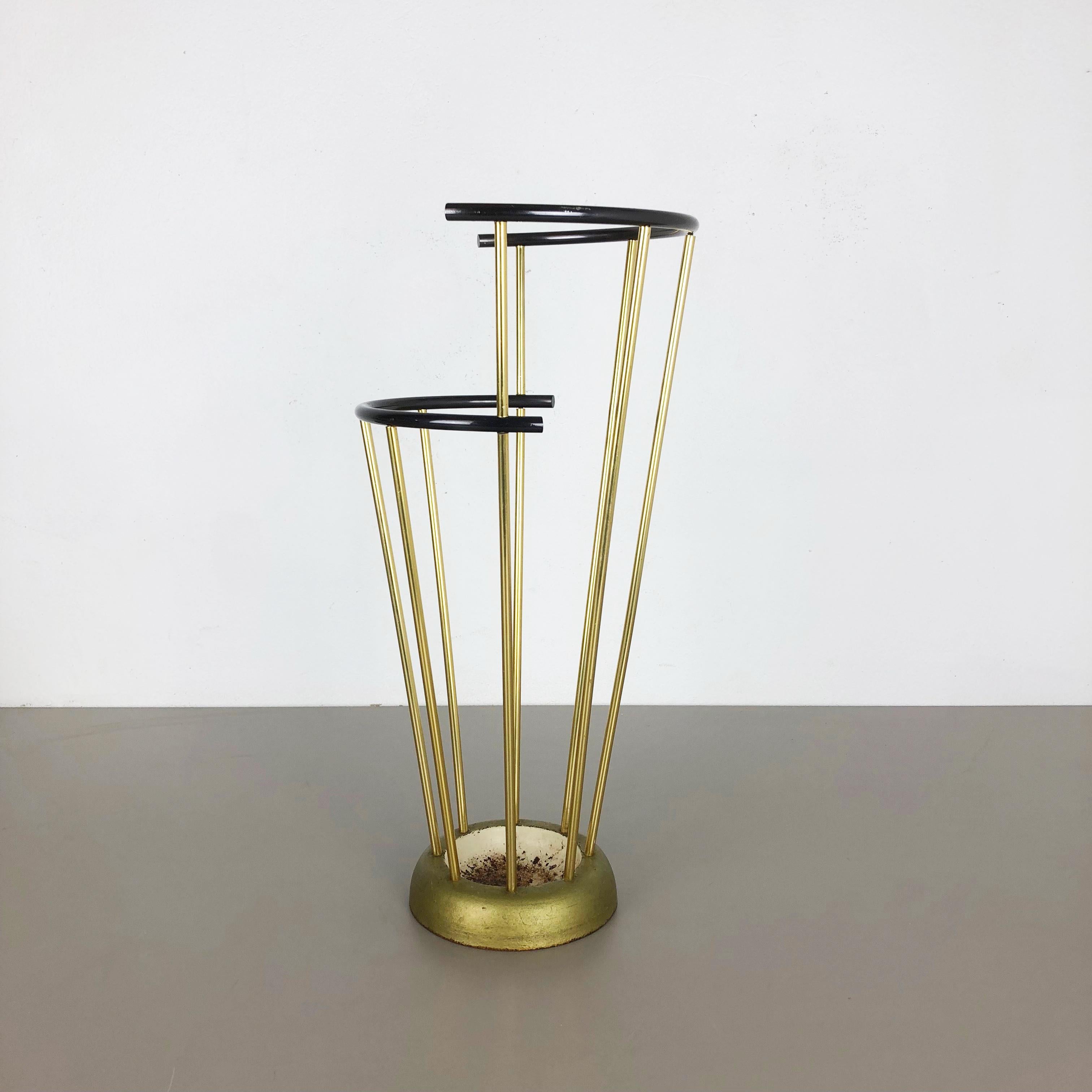 Article:

Bauhaus umbrella stand


Origin:

Germany


Producer:

Geco Metall, Germany


Age:

1950s


This original vintage Bauhaus style umbrella Stand was produced in the 1950s in Germany by Geco Metall. the brass colored top elements are made of