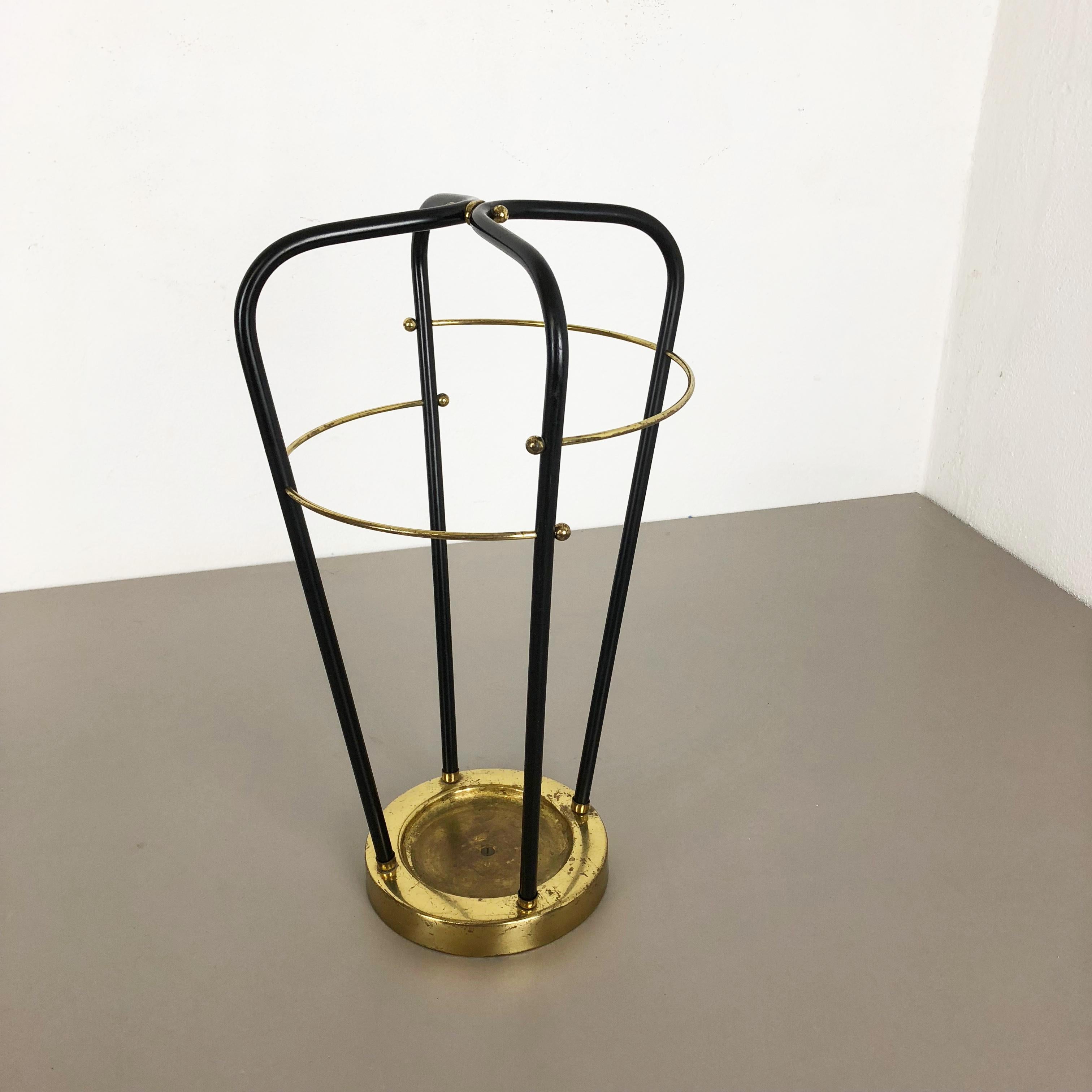 Article:

Bauhaus umbrella stand


Origin:

Germany


Age:

1950s


This original vintage Bauhaus style umbrella stand was produced in the 1950s in Germany. The bottom dipping base top elements has a golden then brass finish, the