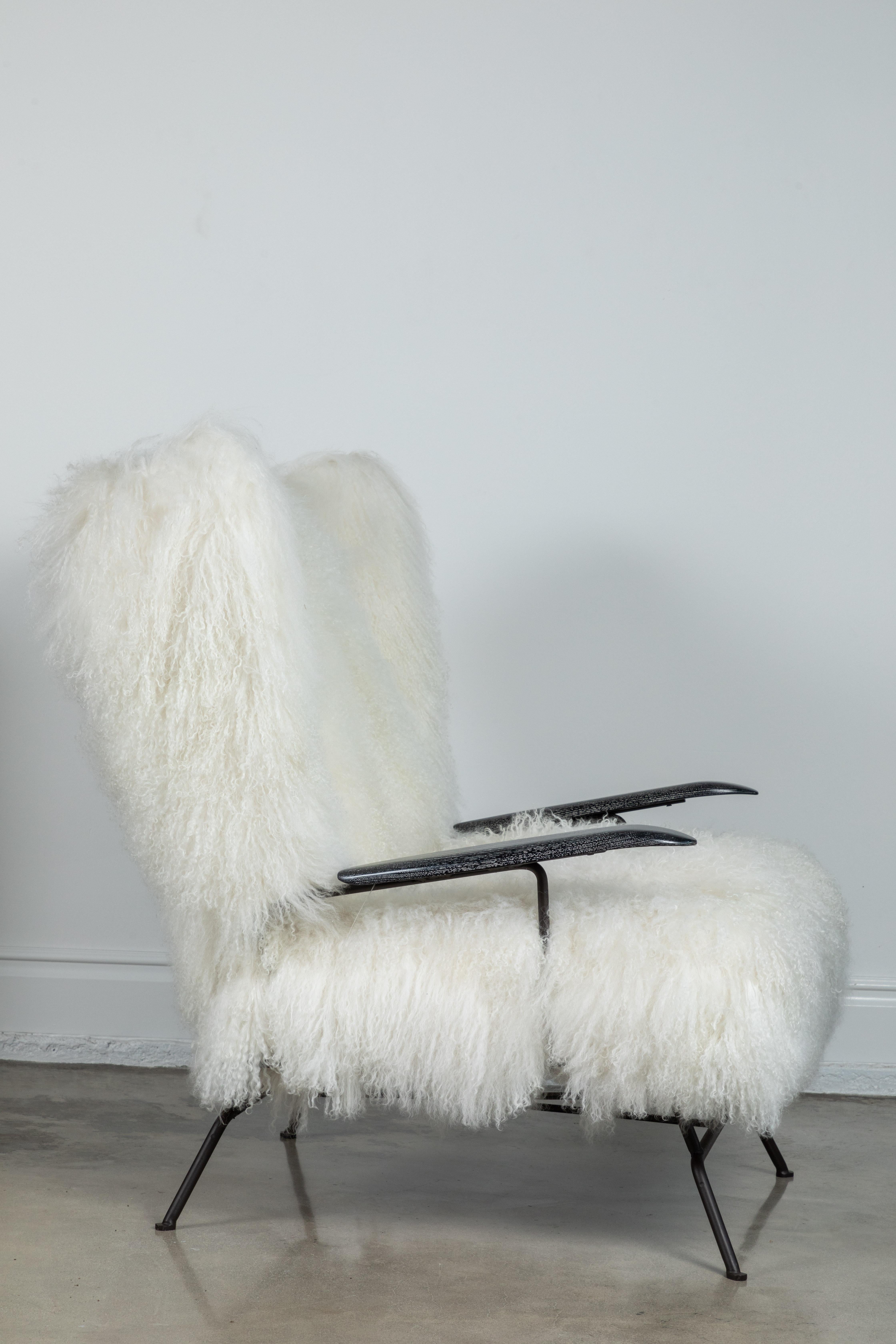 Midcentury metal wing-back chair, 1960s in the style of Mauritzio Tempestini. Chair has cerused oak arms, been newly powder-coated and re-imagined in a white Tibetan lamb upholstery.