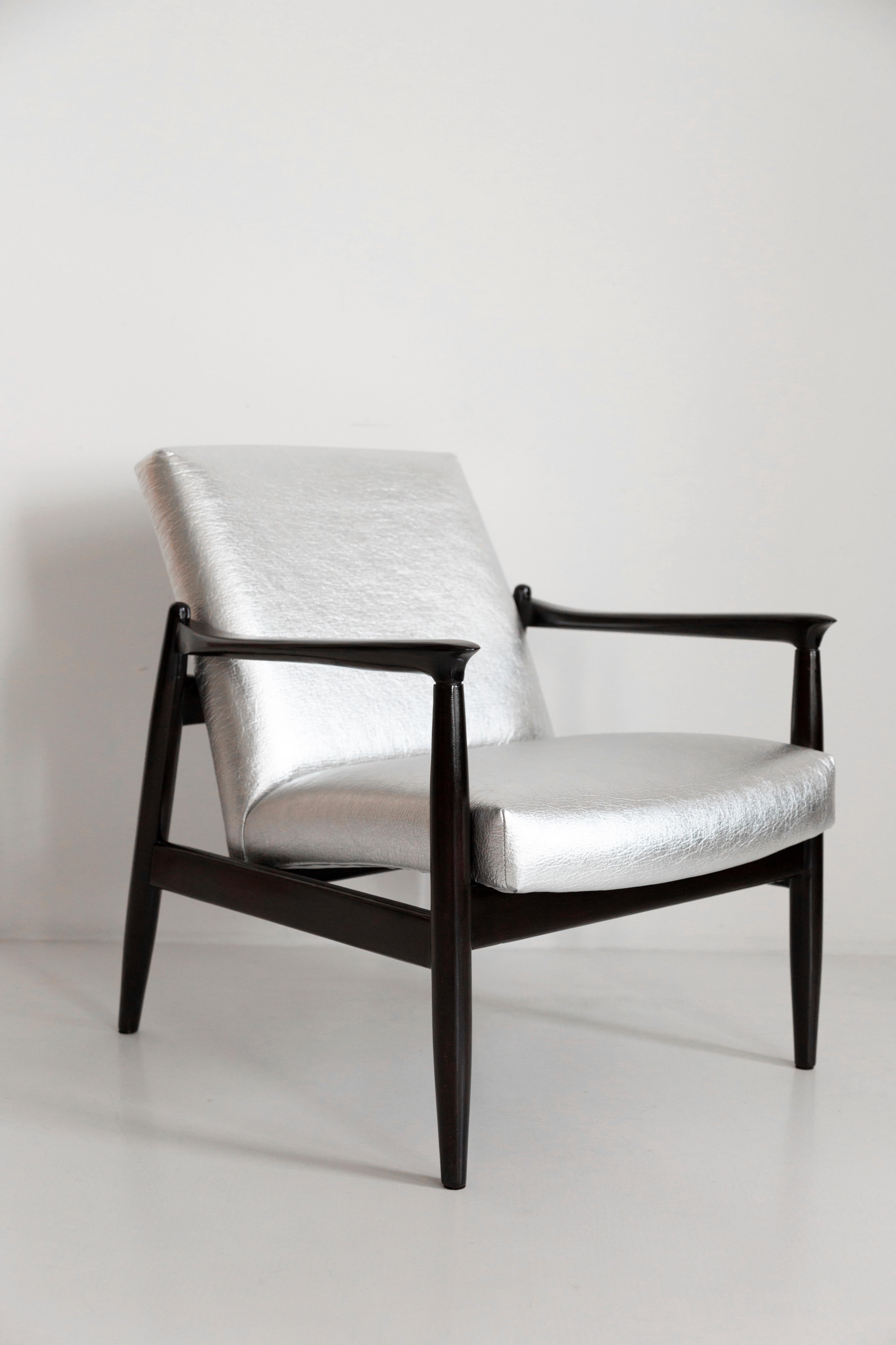 Beautiful armchair designed by Edmund Homa. 

The armchair was made in the 1960s in the Gosciecinska Furniture Factory from solid beechwood. The GFM type armchair is regarded one of the best polish armchair design from the previous age. The armchair