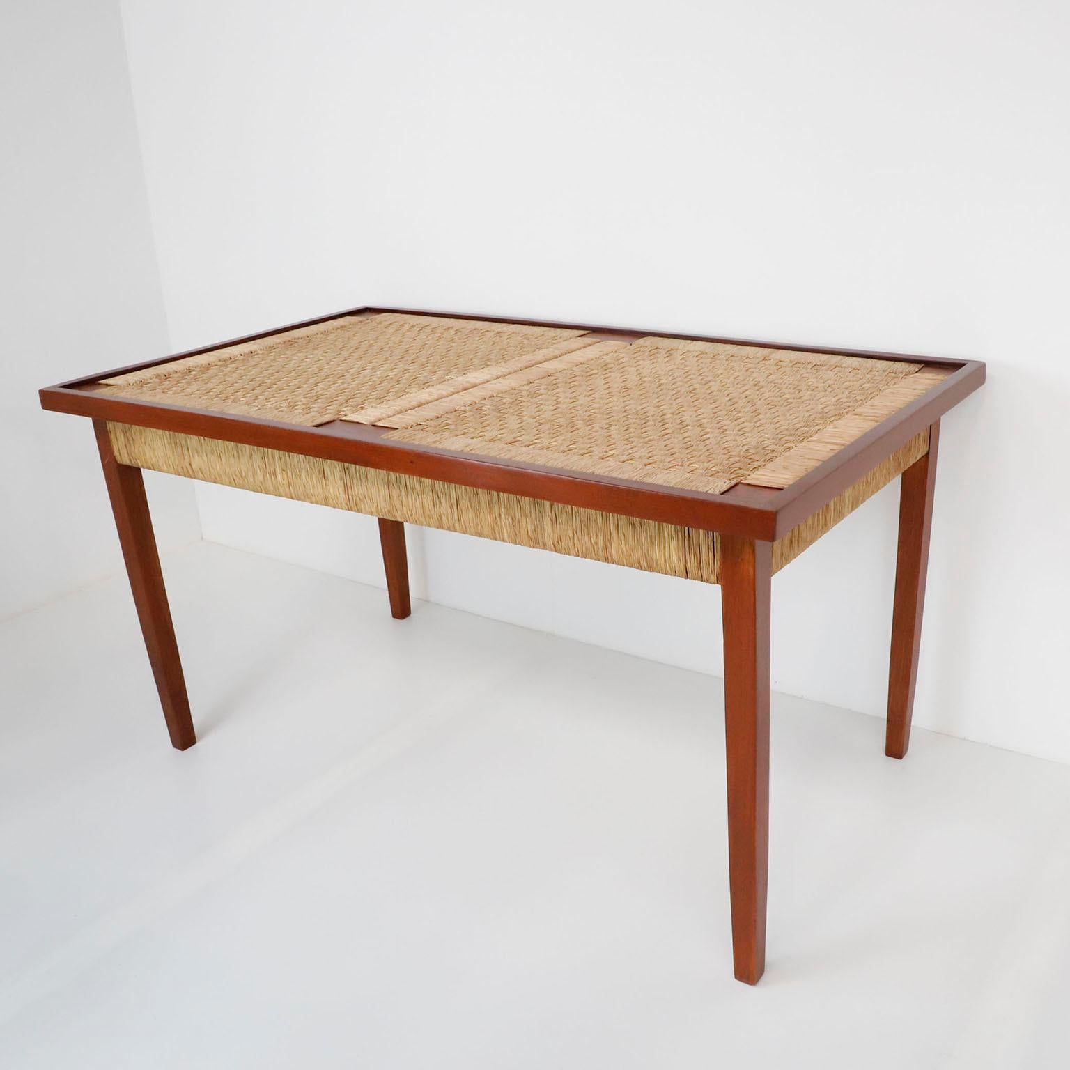 We offer this Dinning Table in the style of Michael Van Beuren made in premium mahogany wood and palm cords, circa 1960. Great vintage conditions.

Note: The table requires a glass but due to fragility we do not included.