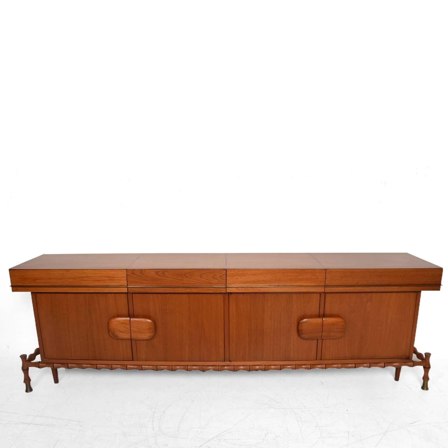 For your consideration a beautiful floating credenza.
(Beautiful faux bamboo details).
Made of Mexican Mahogany and brass.
circa 1960s.
by Frank Kyle.
Unmarked no signature from the maker.
Dimensions: 35” H x 106” W x 20” D.