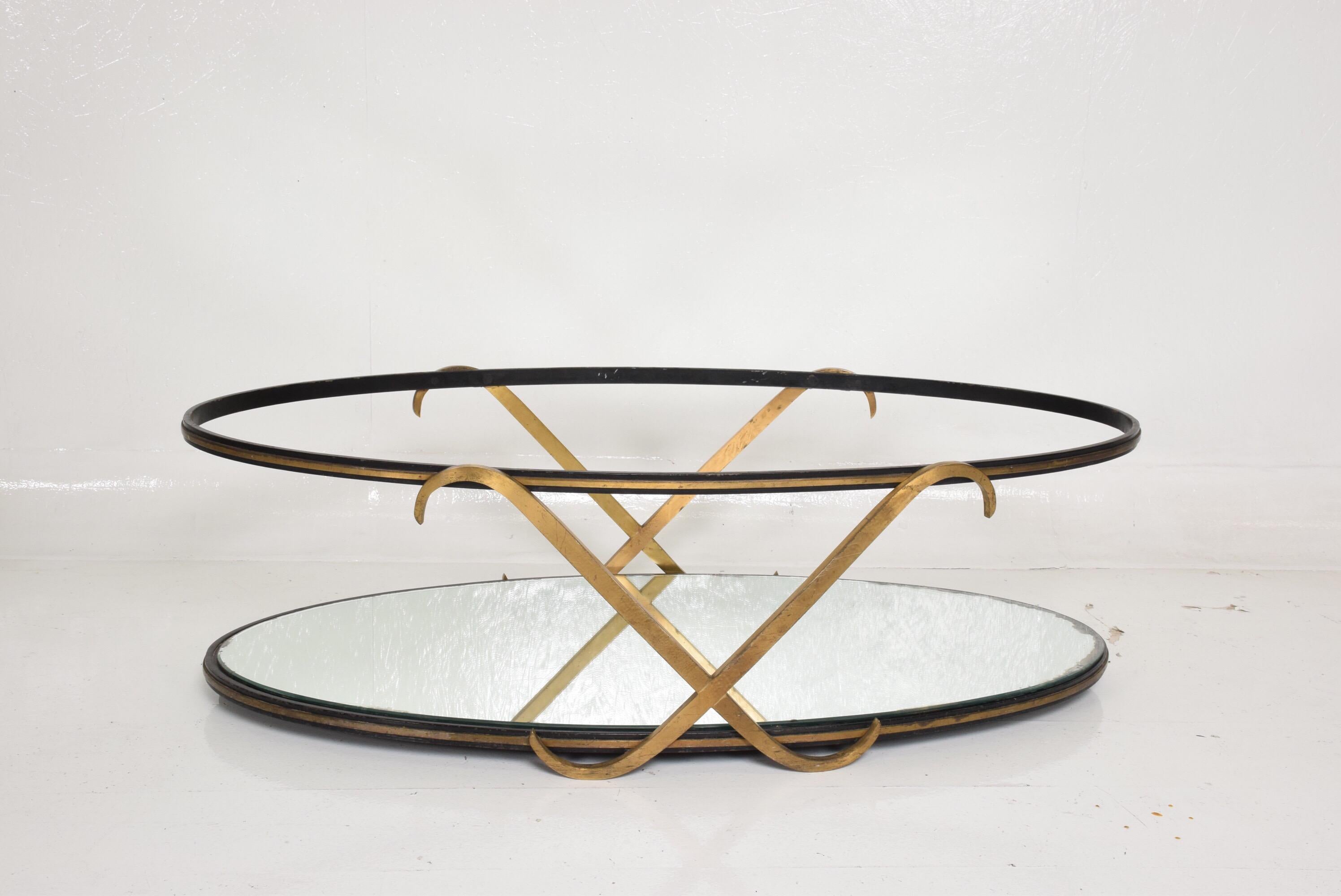 For your consideration, an oval coffee table after Arturo Pani, midcentury Mexican Modernist period.
Mexico, circa 1950s. Iron frame with brass 