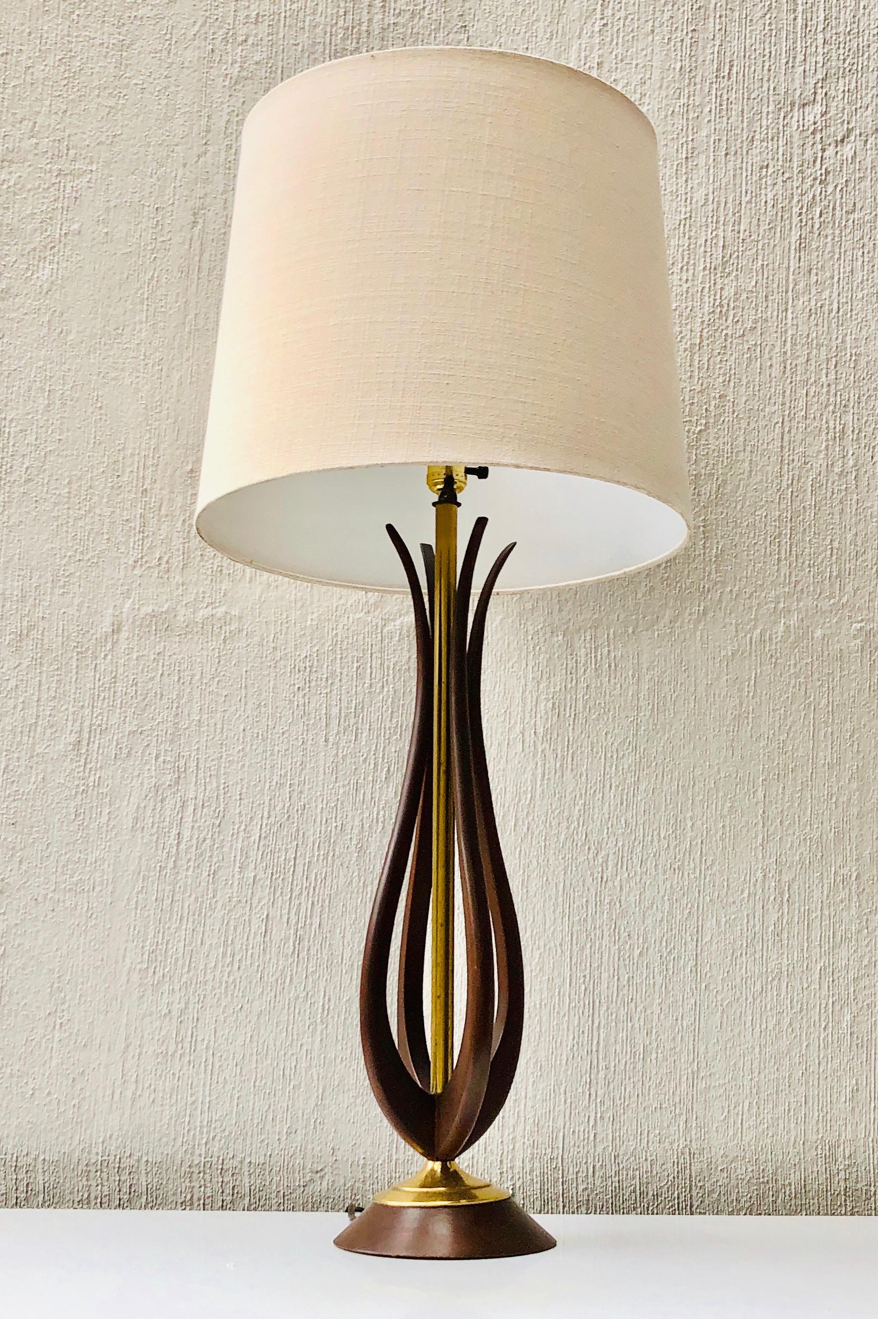 Lamps in mahogany wood and brass.