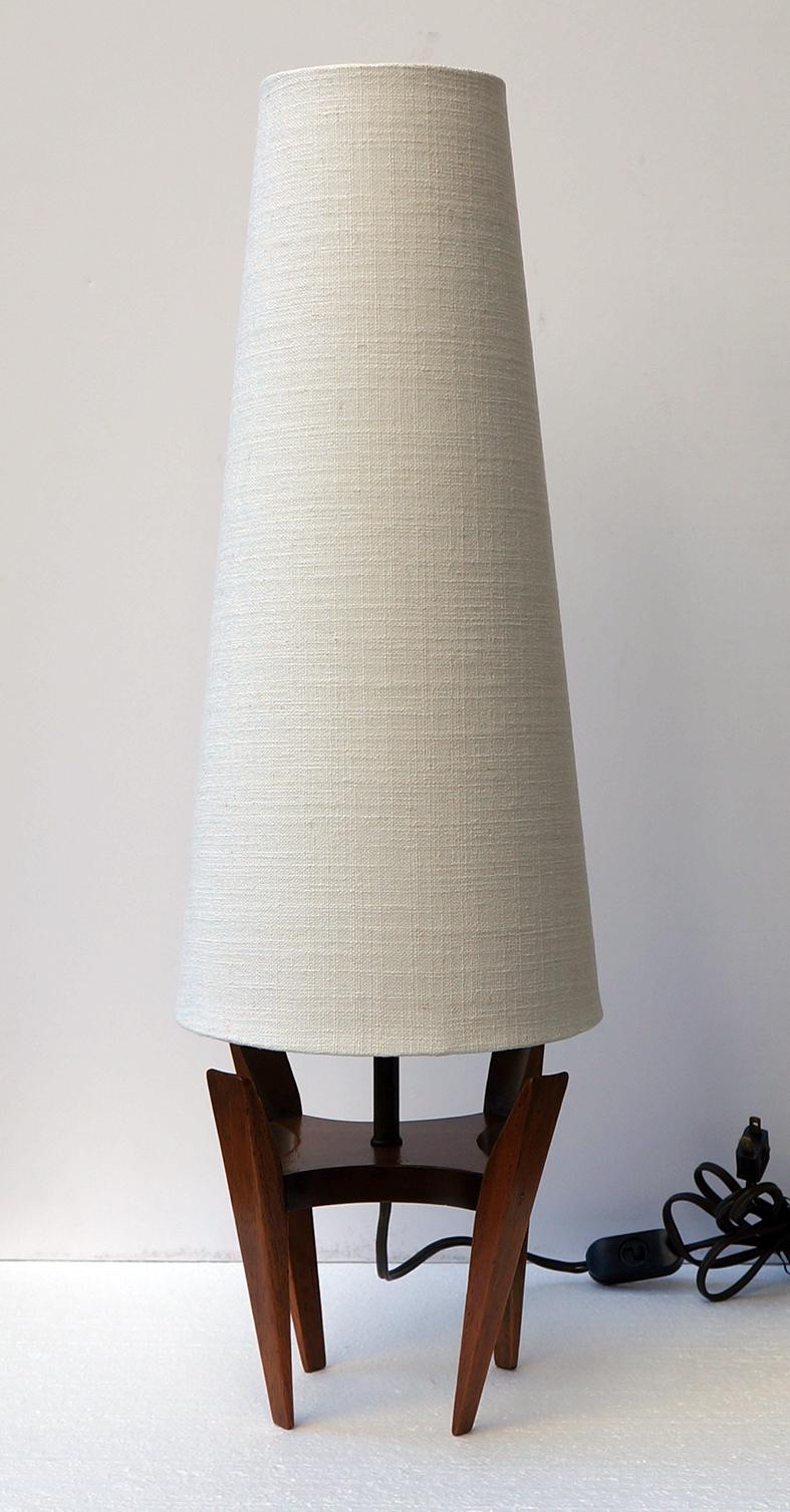 Pair of lamps in mahogany wood with a very stylized design, the lampshade has been renewed.