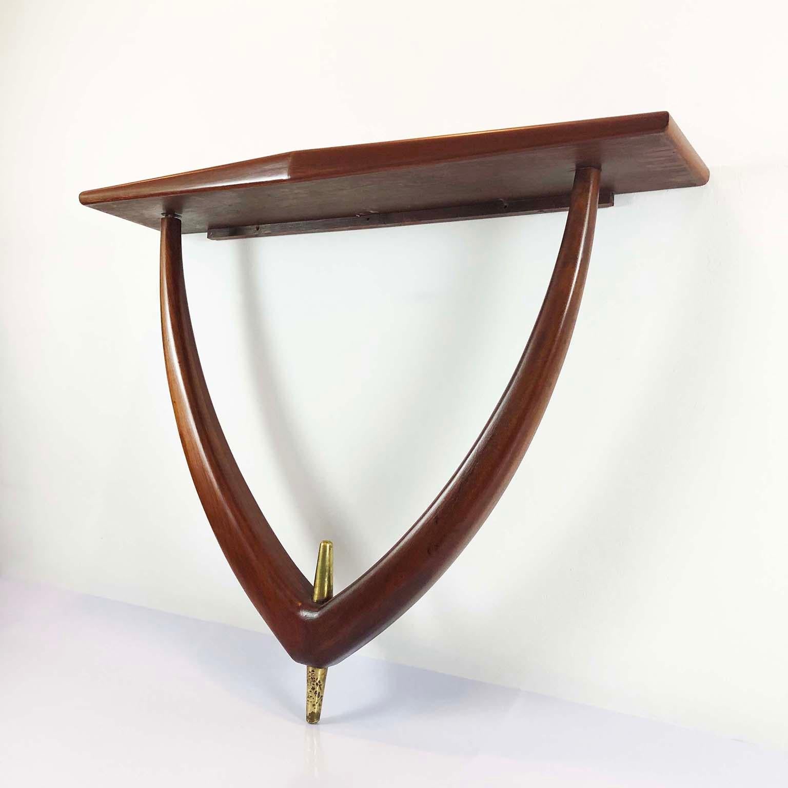 We offer this beautiful curvy shaped wall-mounted console in a fantastic mahogany wood. Narrow proportions and nice size for a small entry or hallway, circa 1960.