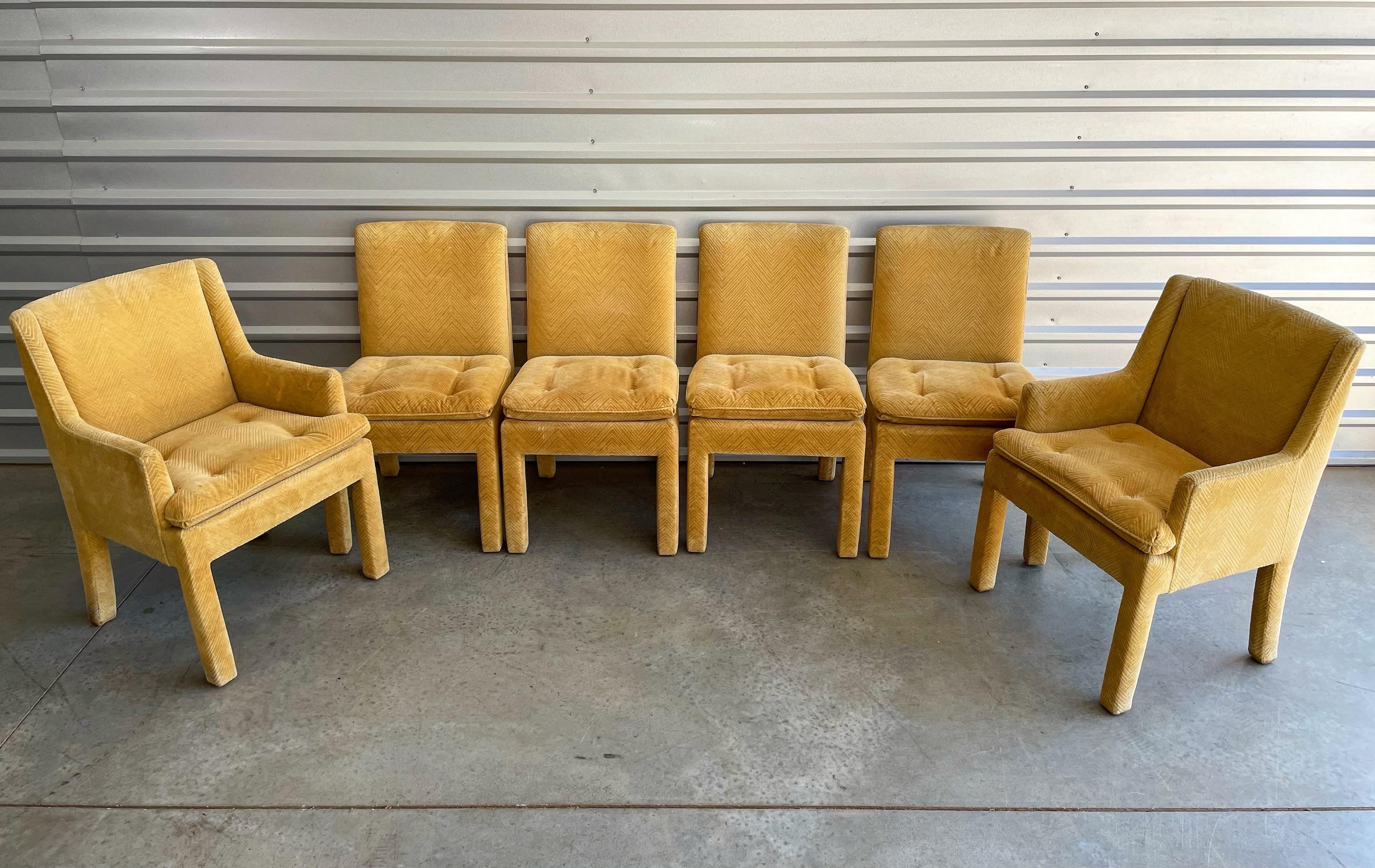 Set of 6 fully upholstered Parsons style dining chairs by Milo Baughman for Thayer Coggin in a harvest gold maize chevron. Two arm captain's chairs and four side chairs. Original upholstery is in very good condition, showing very minor signs of use.