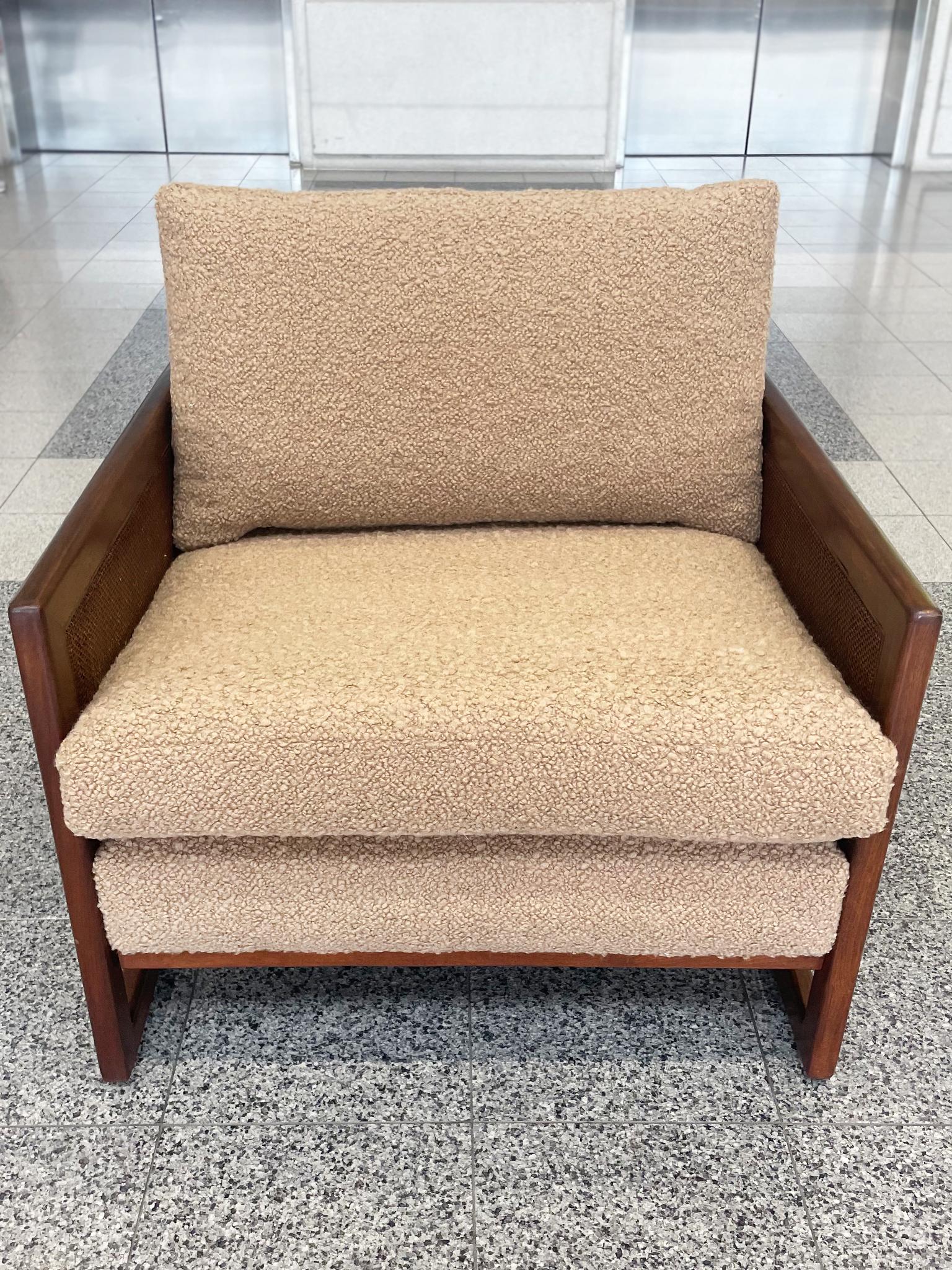 Midcentury lounge chair in the style of Milo Baughman. Constructed with cane side panels and sleigh legs. With its new custom bouclé upholstery, this chair is even more cozy and ideal for relaxing.

Dimensions:
30 in. width
36 in. depth
29 in.