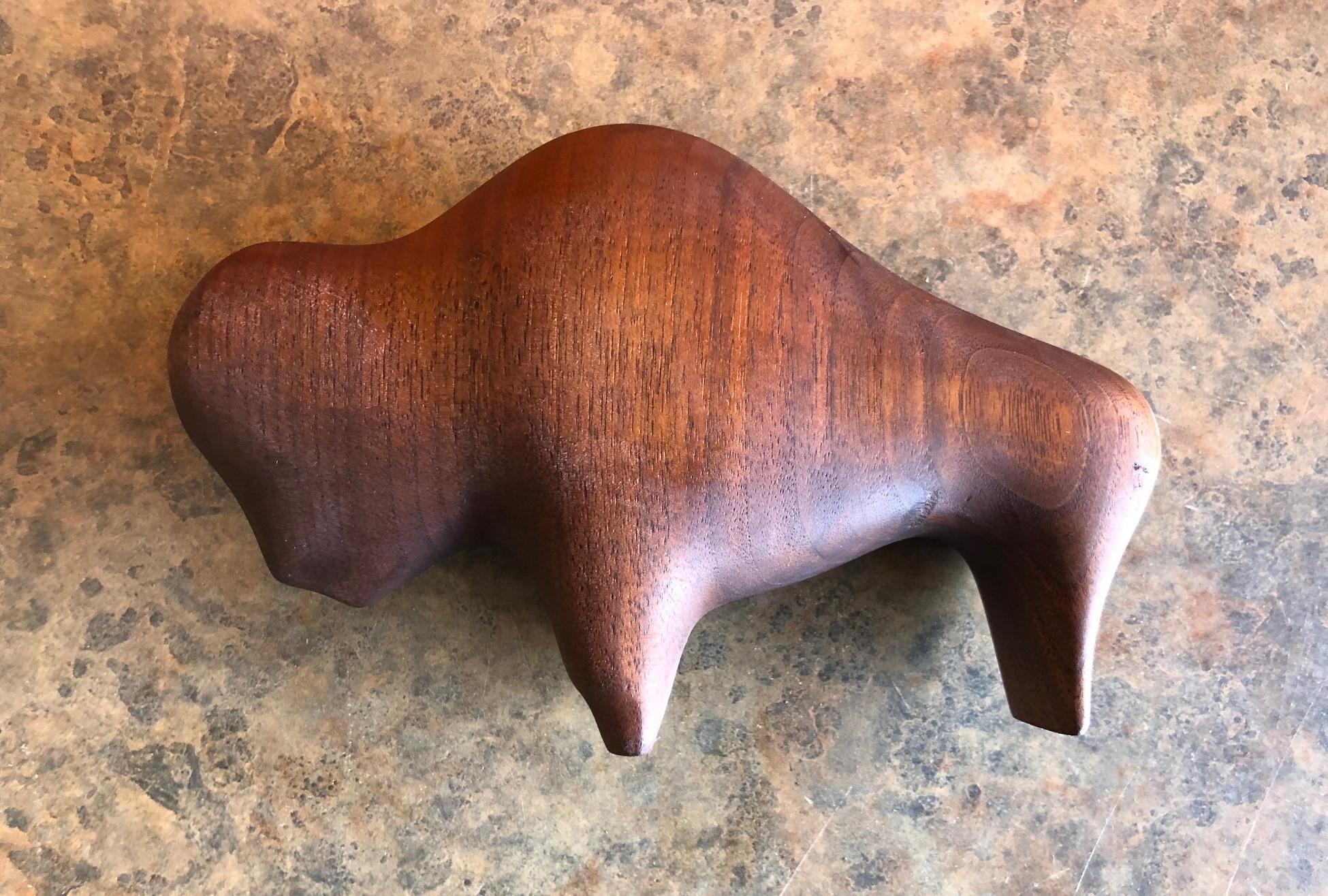 A very cool midcentury Minimalist buffalo carving in walnut signed by Canadian artist Alan Middleton, circa 1960s.
