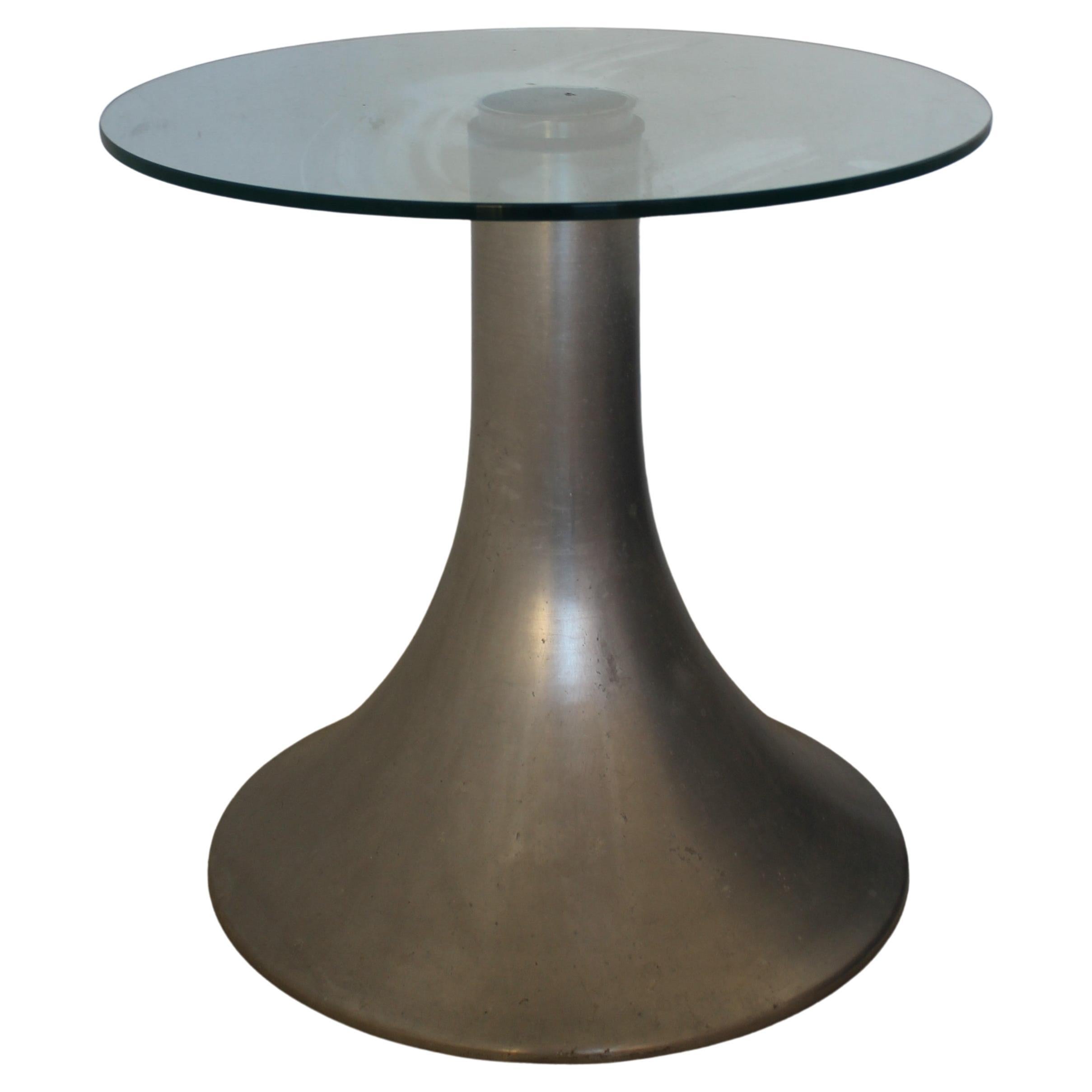 MidCentury Modern aluminium and glass small side Table, Italy 70s

This coffee table with conical truncated aluminium base and glass top is a typical example of Italian Design of 1970s.