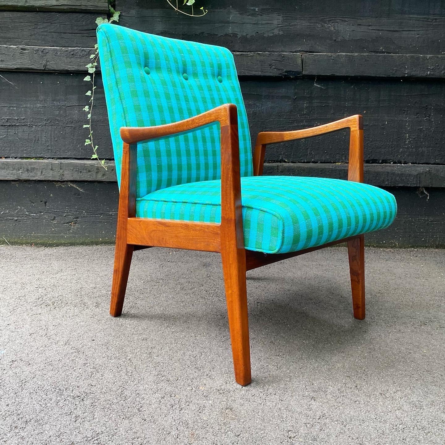This is a studio craft solid walnut lounge chair designed and handmade by Arden Riddle, ca. 1960's. The chair features new old stock green and blue check upholstery from Arden's studio. The foam and fabric were professionally replaced by Copley