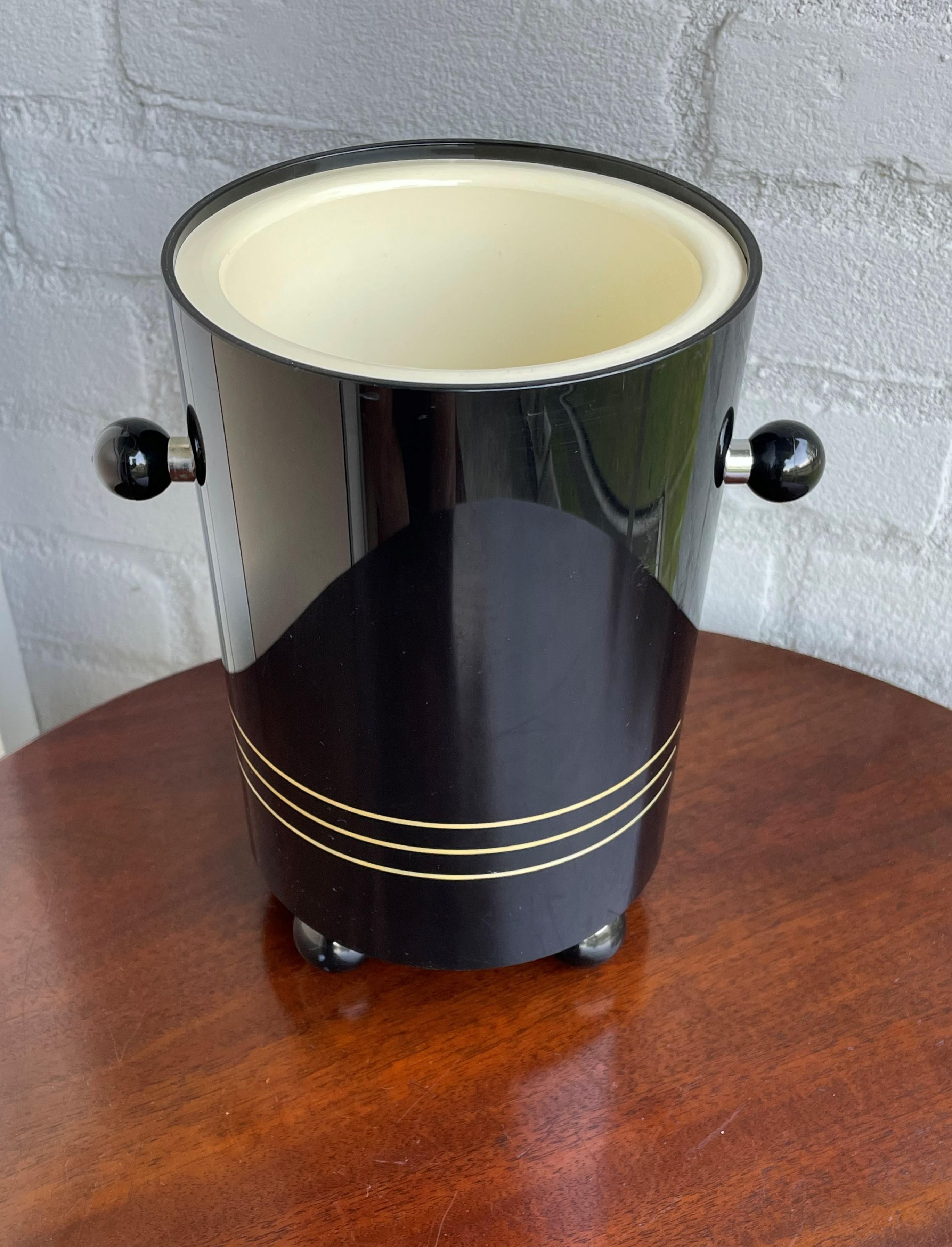 The coolest and rarest midcentury wine & champagne cooler on the platform. 

1stdibs is known for offering the most beautiful things on earth and often those things also are the rarest things on earth. That certainly is the case with this Art Deco