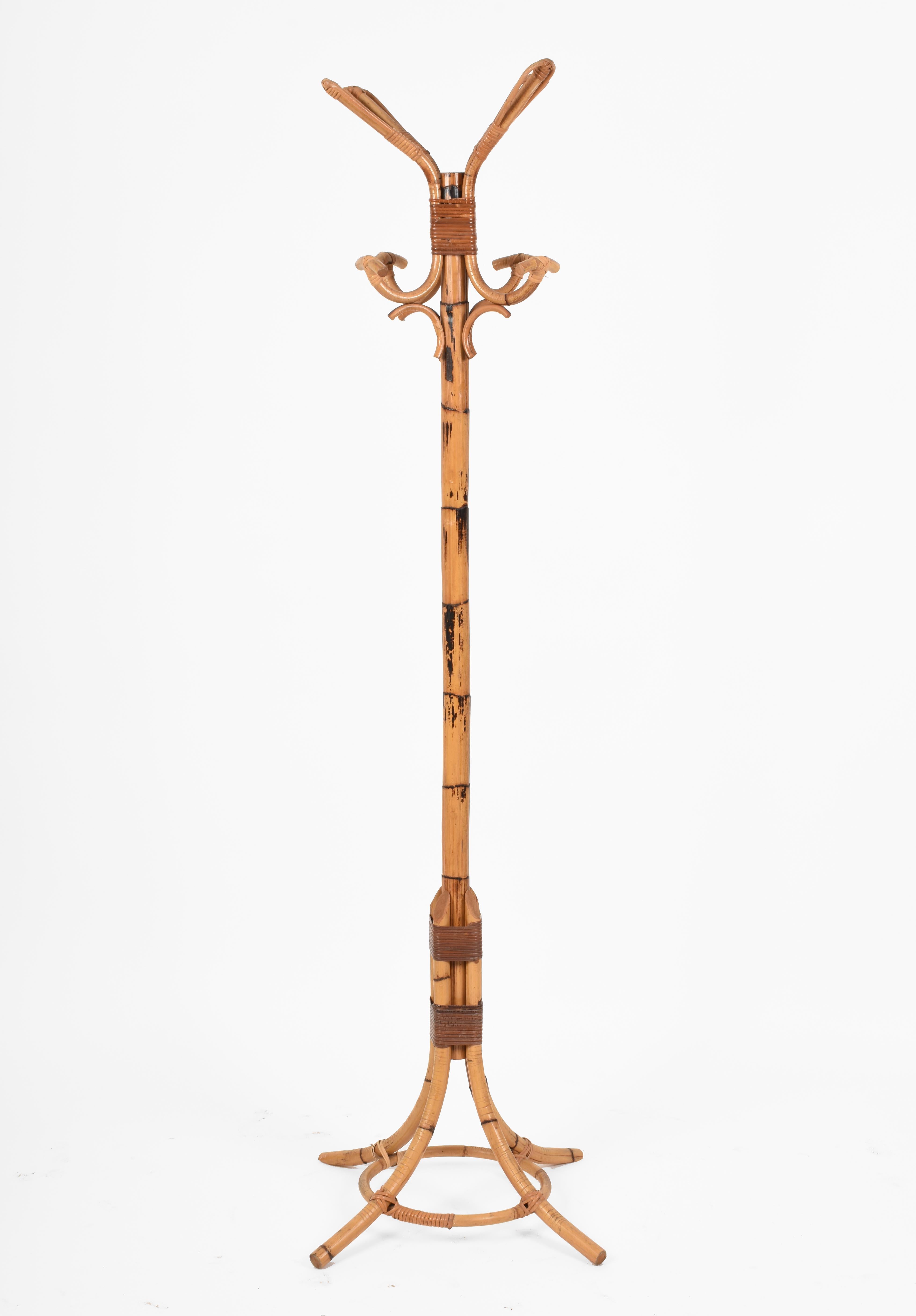 Amazing midcentury bamboo coat stand. This amazing piece was produced in Italy during the 1970s.

The composition and the mix of bamboo and rattan are just spectacular, with the use of these materials both for decorative and structural