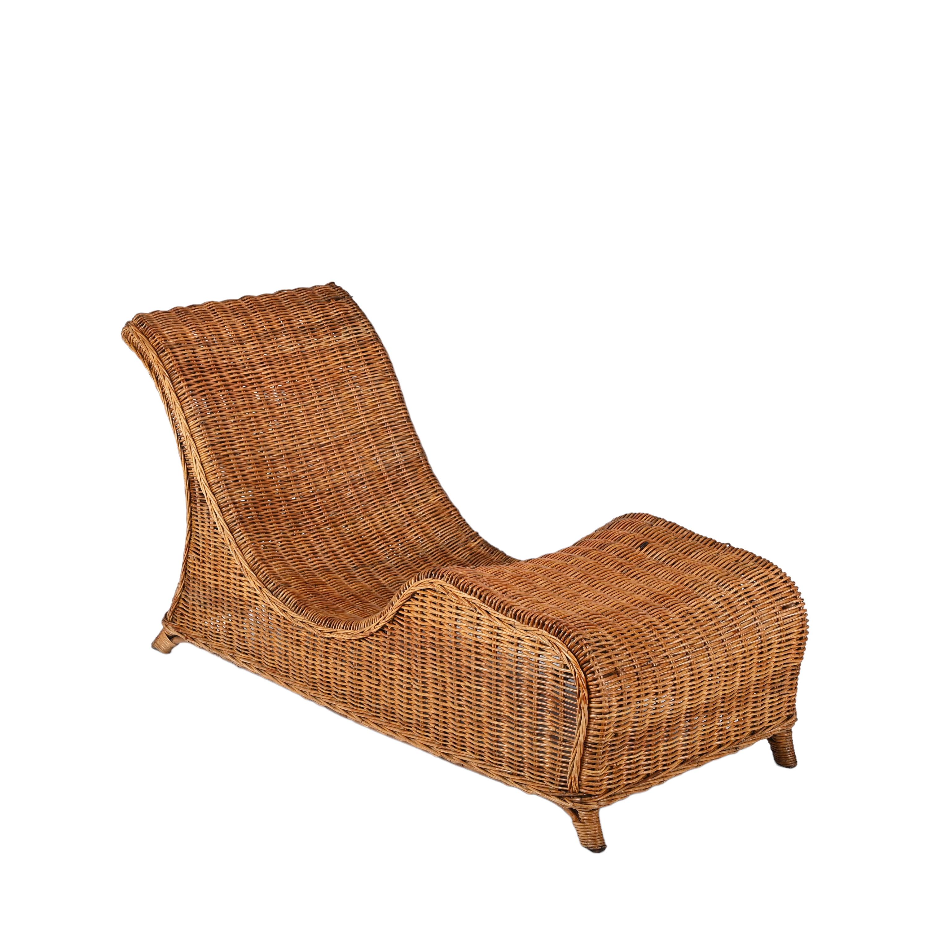 Amazing midcentury modern bamboo and wicker chaise lounge. This fantastic piece was designed in Italy during the 1960s .

This piece is incredible as the materials are wonderfully merged with curved and sinuous lines. Regardless of the toughness of