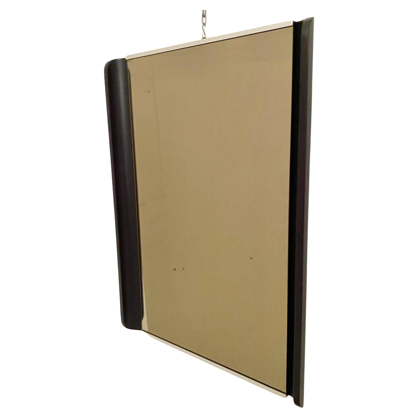 Midcentury Modern Barber Shop Wall Mirror, Italy 1970

An authentic Midcentury Modern barbershop wall mirror, manufactured in Italy in the 1970s, featuring a sleek chromed iron frame with distinctive curved black iron listels on the lateral sides.