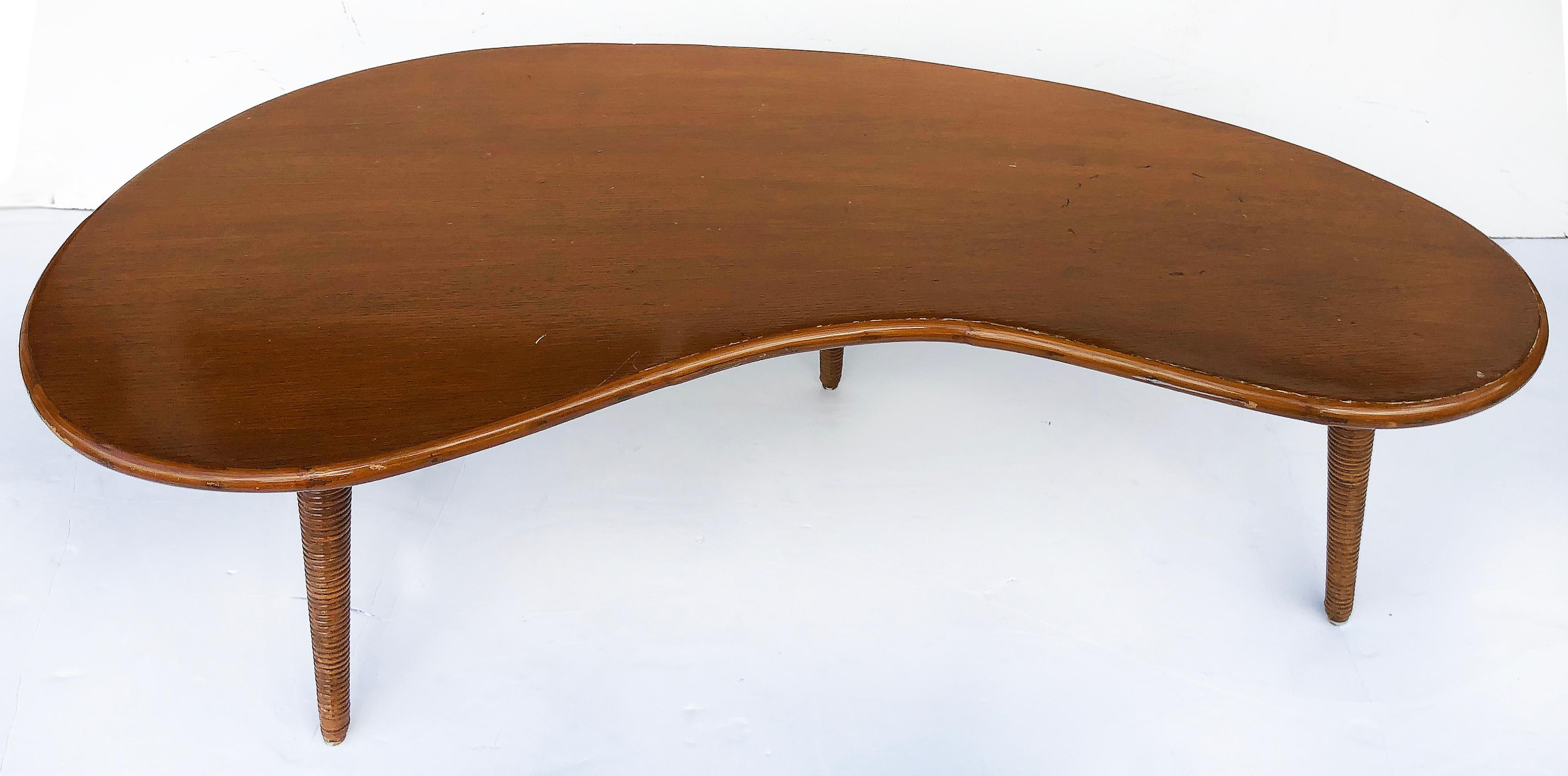 Mid-Century Modern biomorphic shape coffee table with splayed reed legs


Offered is a sinuous 1950s biomorphic form coffee table with tapered splayed legs that have split rattan reed details. The table is in original condition with a vintage