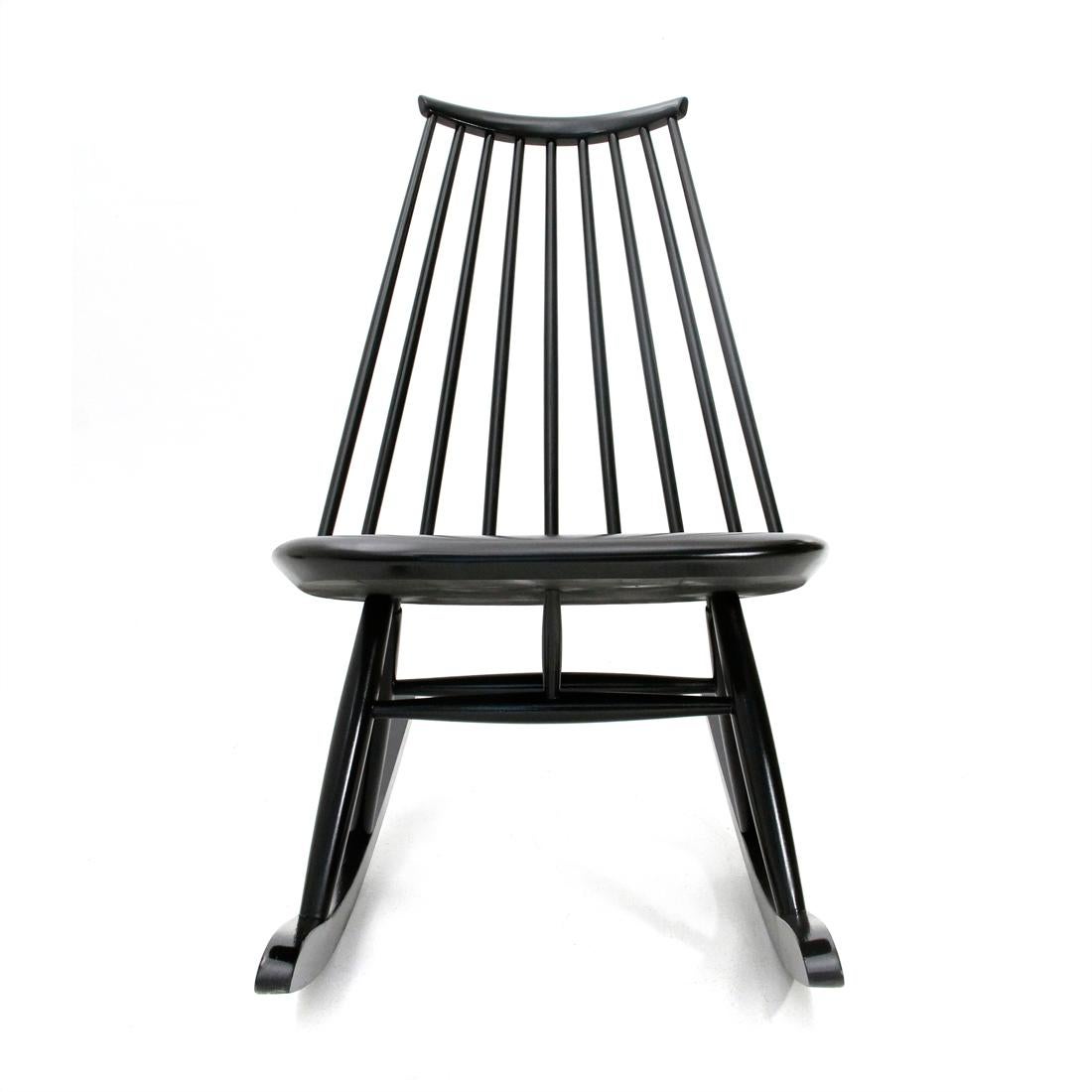 Rocking chair produced by Artek in the 1950s based on a design by Ilmari Tapiovaara.
Structure in solid birch black painted.
Completely restored.
Good general conditions, some signs due to normal use over time.

Dimensions: Length 55 cm, depth