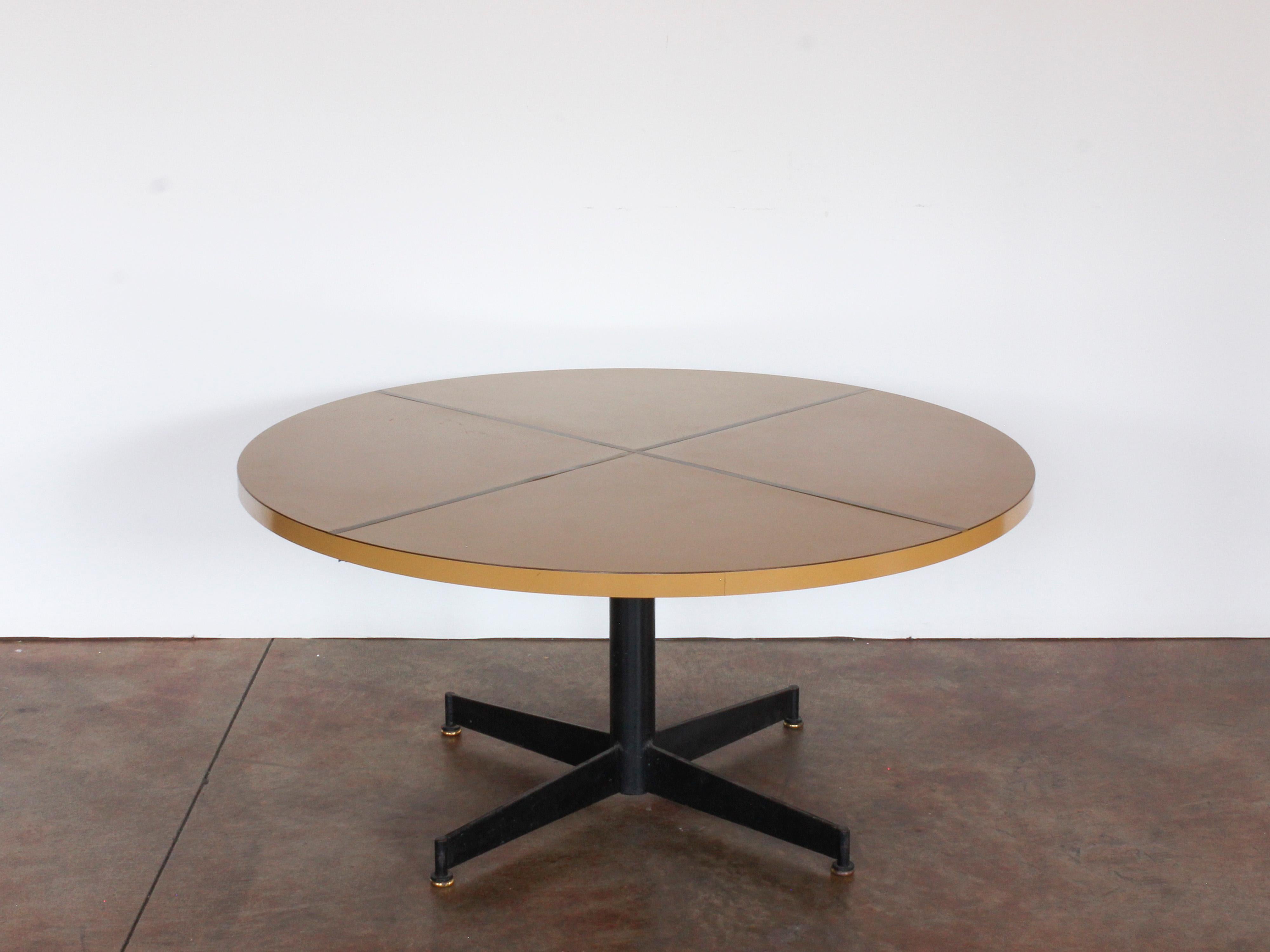 Mid-Century Modern blackened iron and melamine round table with brass inlay, c. 1960. Adjustable height 20-27