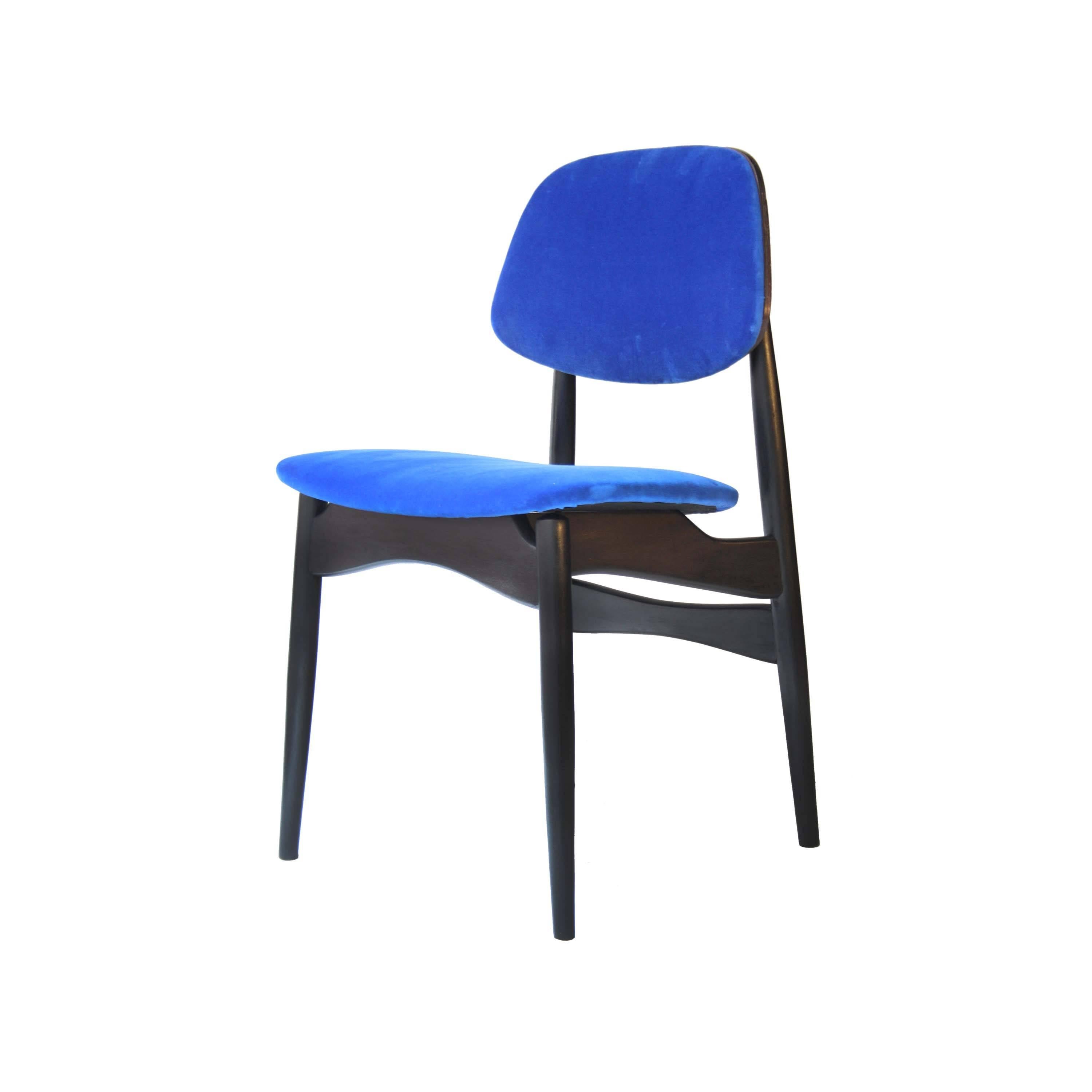 Set of four chairs in solid ebonized wood with back covered with wood upholstered in blue cotton velvet edited by Gancedo.