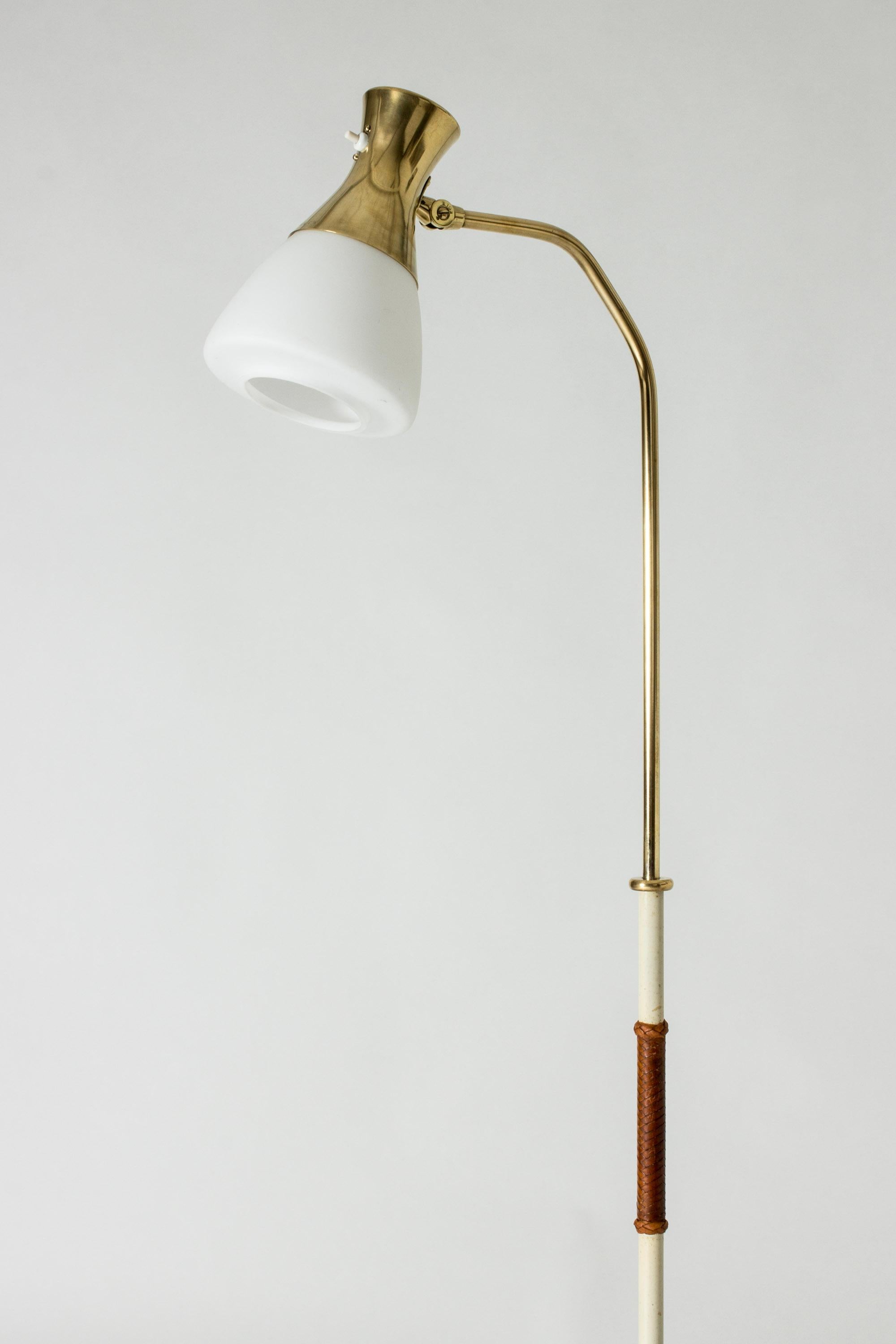 Neat Swedish Modernist brass floor lamp, with a flexible neck and adjustable height.