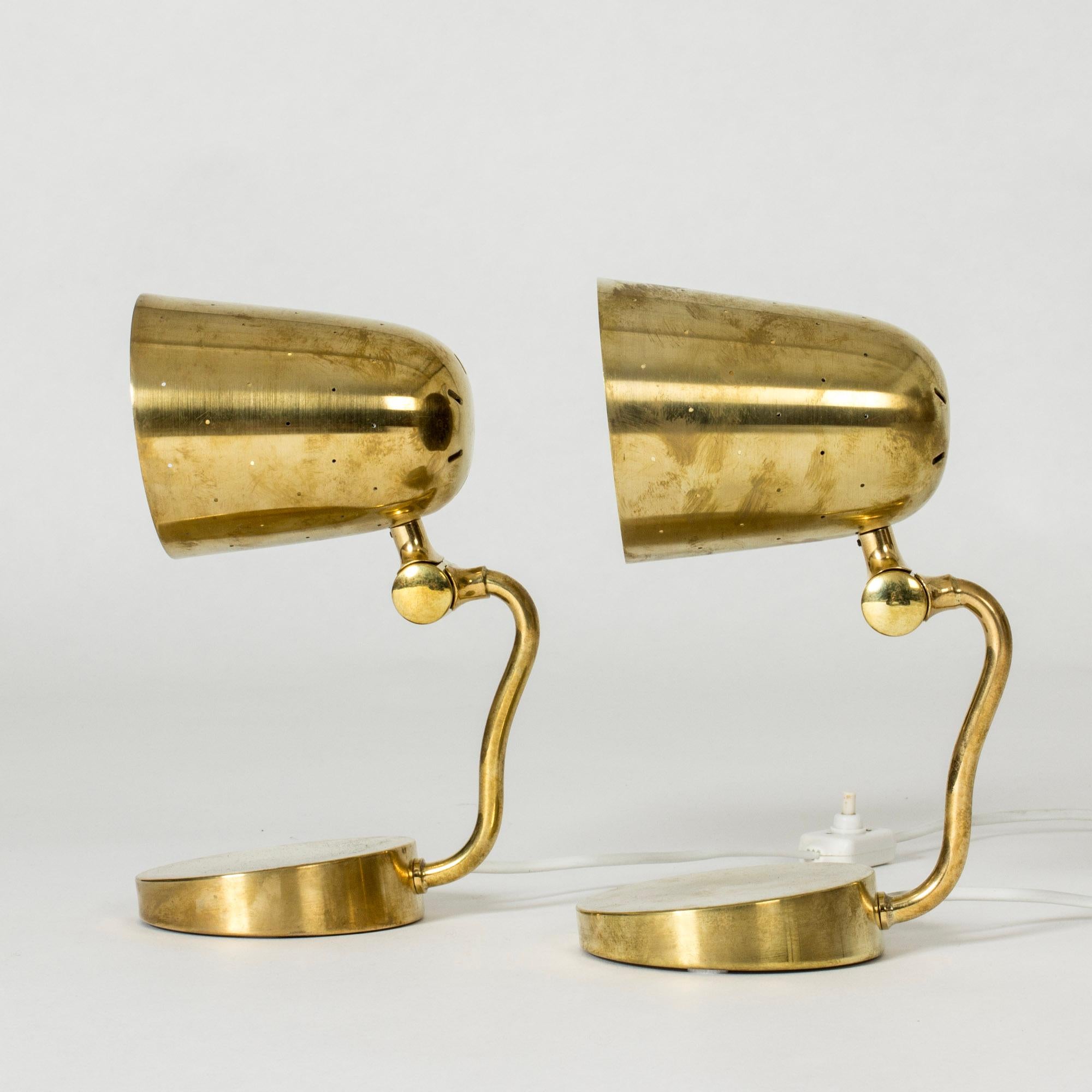 Pair of lovely small table or uplight wall lamps from Boréns. Neat design with perforated shades that create a pattern of light. Nicely slanted bases.