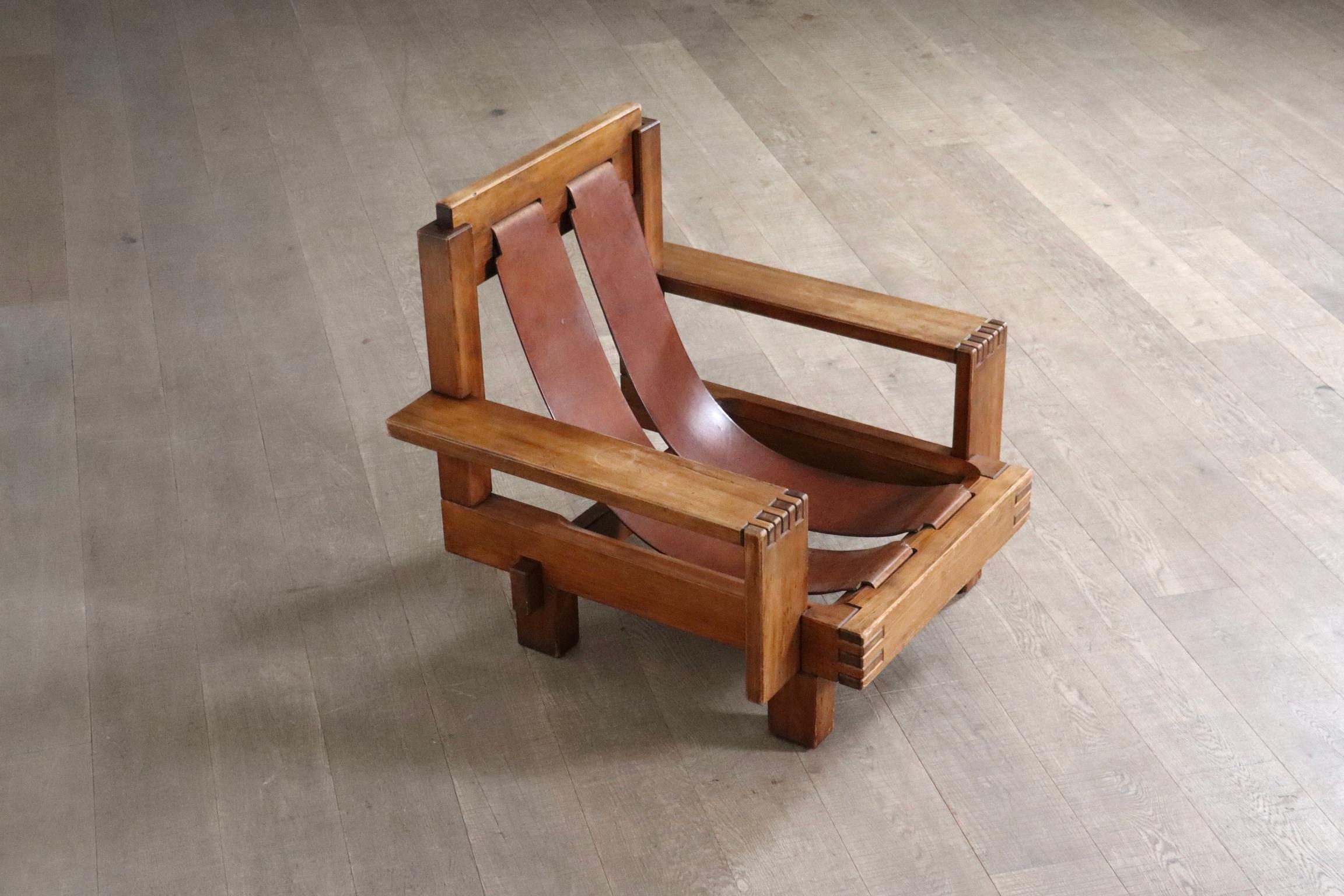 
Beautiful Brutalist lounge chair in oak and leather, Italy 1970s.

This one of a kind lounge chair showcases immaculate craftsmanship, with high attention to detail. Although the designer is unknown, this chair embody the renowned design movement