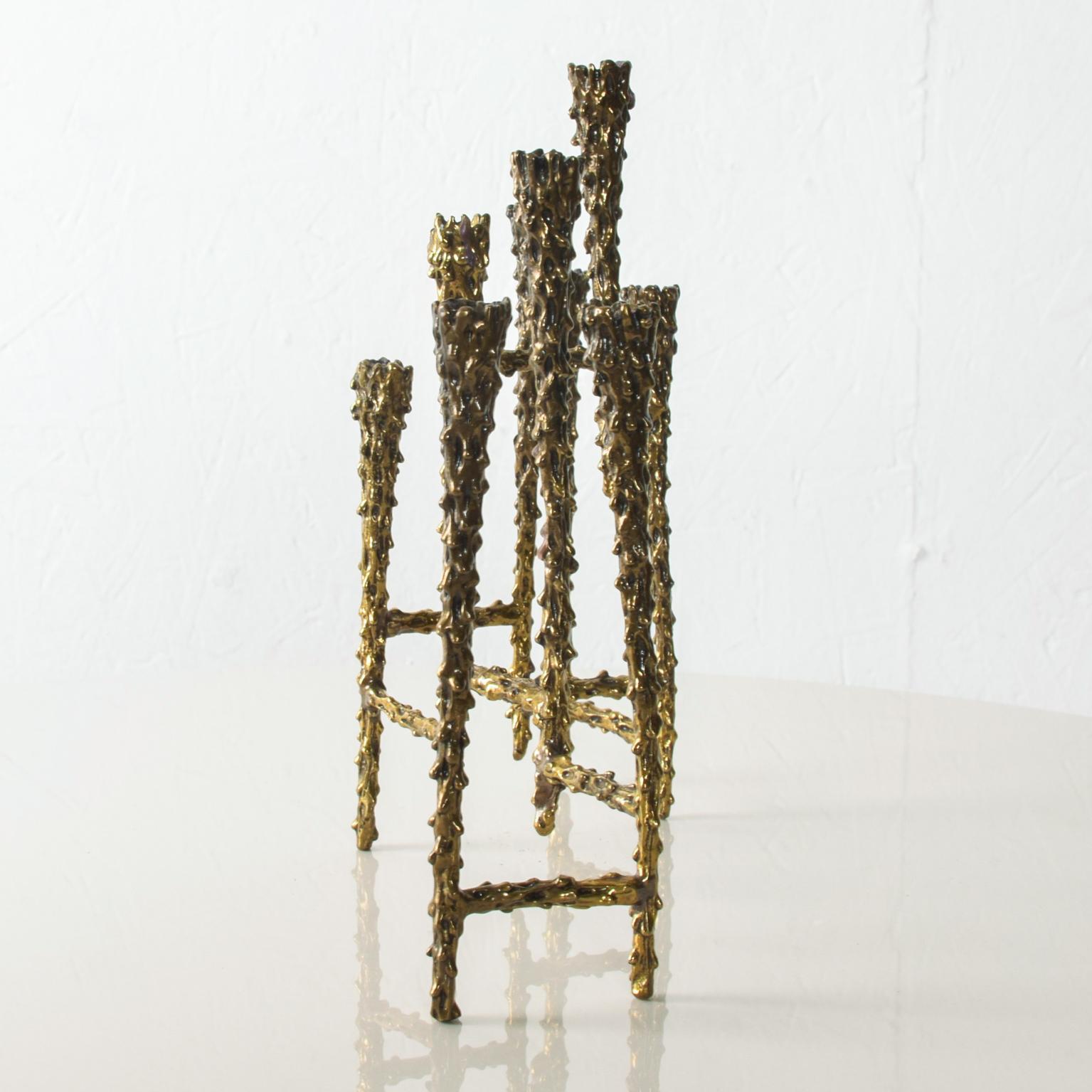 For your consideration: Striking modern tiered Brutalist brass candleholder with 9 slots for candles measures: 6 1/2