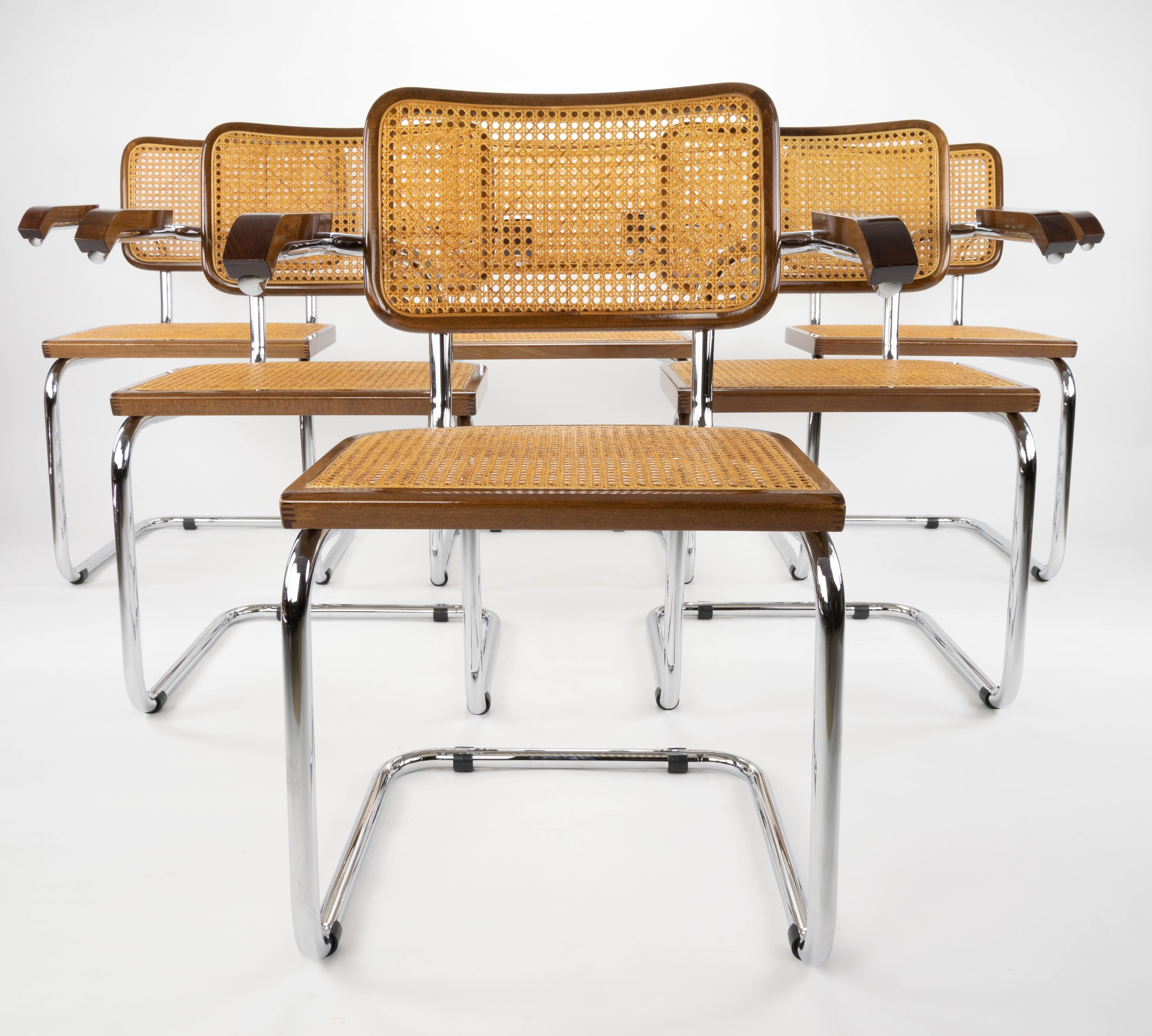 Great set of six chairs model Cesca B64. Chromed tubular structure and beech wood frames in walnut color and Viennese natural grid. Excellent condition in general both of the wooden frames, their natural fiber grids and the chromed