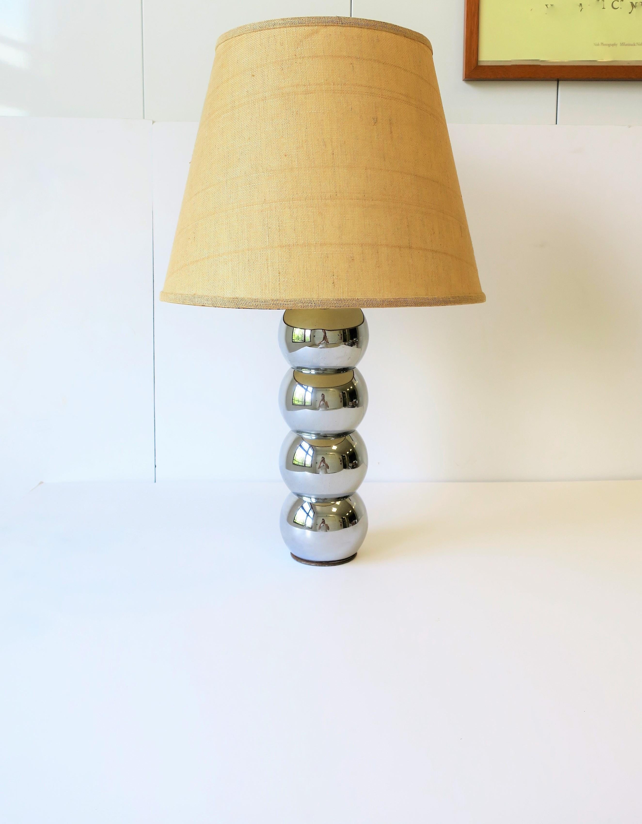 A chic '70s Modern stacked chrome four ball or sphere desk or table lamp attributed to George Kovacs. Lamp is a convenient size too, please note measurements; lamp is smaller in size and great for a small table, nightstand, or desk, as demonstrated
