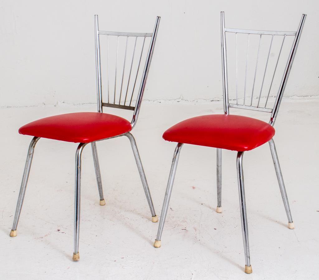 Midcentury modern chrome breakfast chairs,the pair with splayed wire back with finials, the shaped red vinyl rectangular seat above four tubular legs terminating in rubber feet. 

Dealer: S138XX