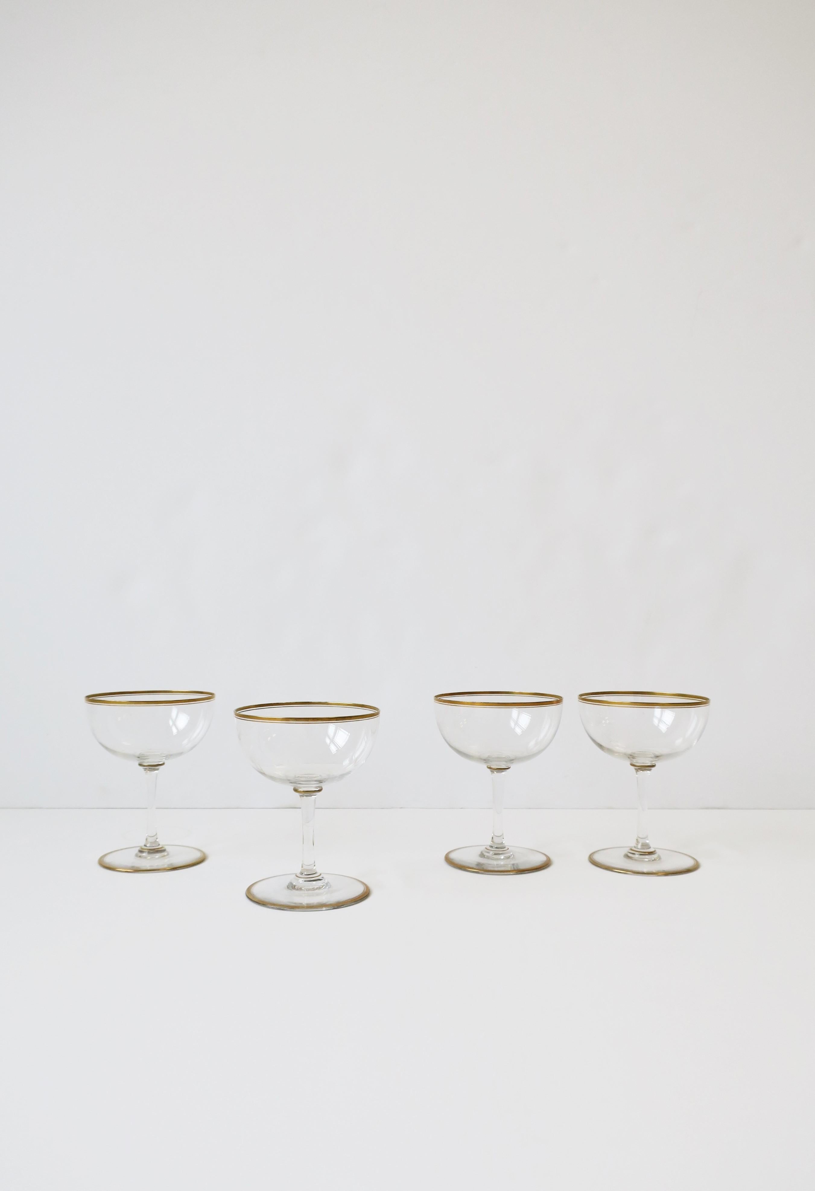 A beautiful set of four (4) Mid-Century Modern cocktail or champagne coupes/glasses with gold detail, circa mid-20th century, Europe. A beautiful set for entertaining, bar, bar cart, etc., or to enjoy everyday. Dimensions: 3.38
