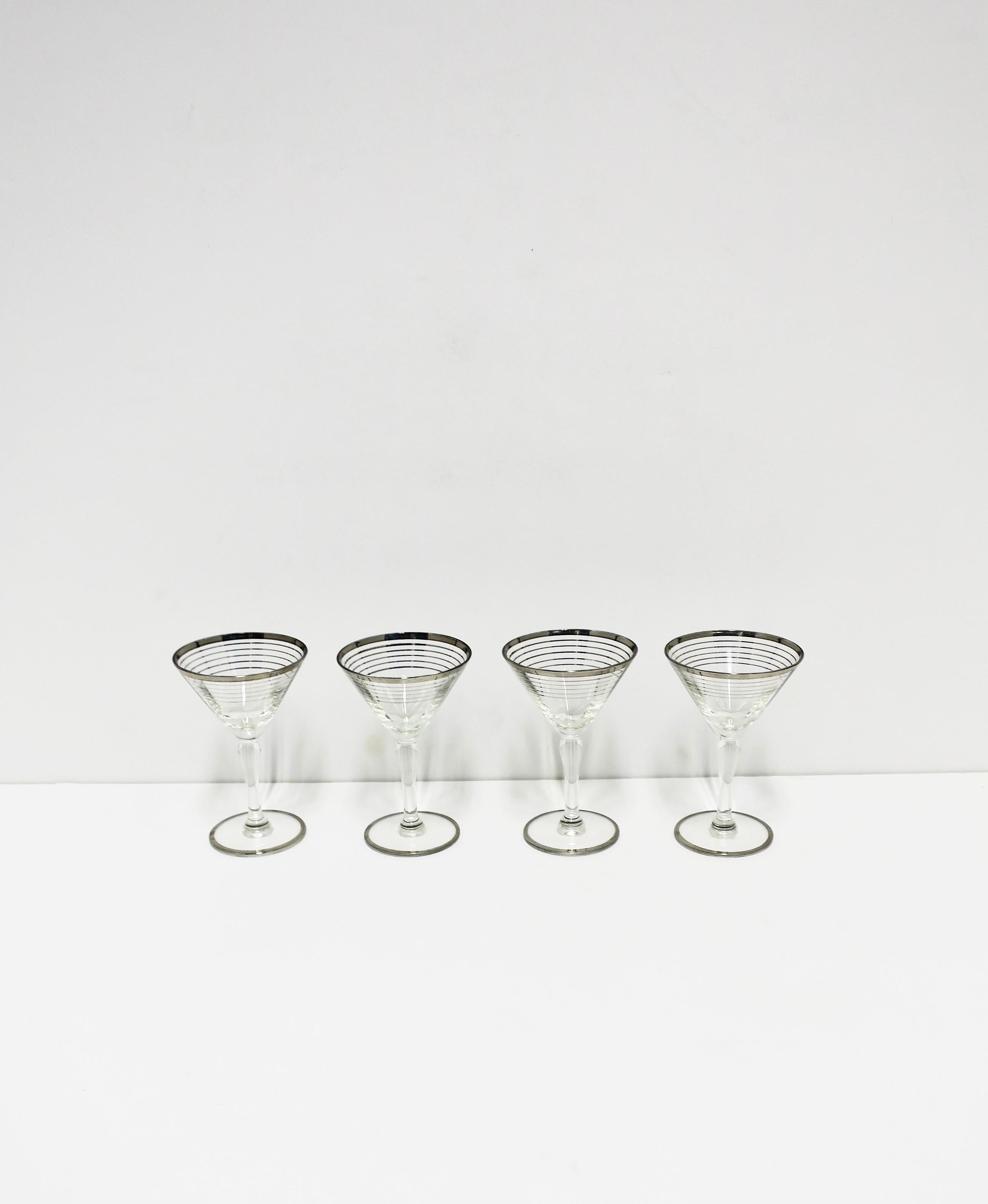 A beautiful set of four (4) Mid-Century Modern cocktail or martini glasses with silver detail, circa mid-20th century, Europe. A beautiful set for entertaining, a bar, bar cart, etc., or to enjoy every day. Glasses are on the smaller side.