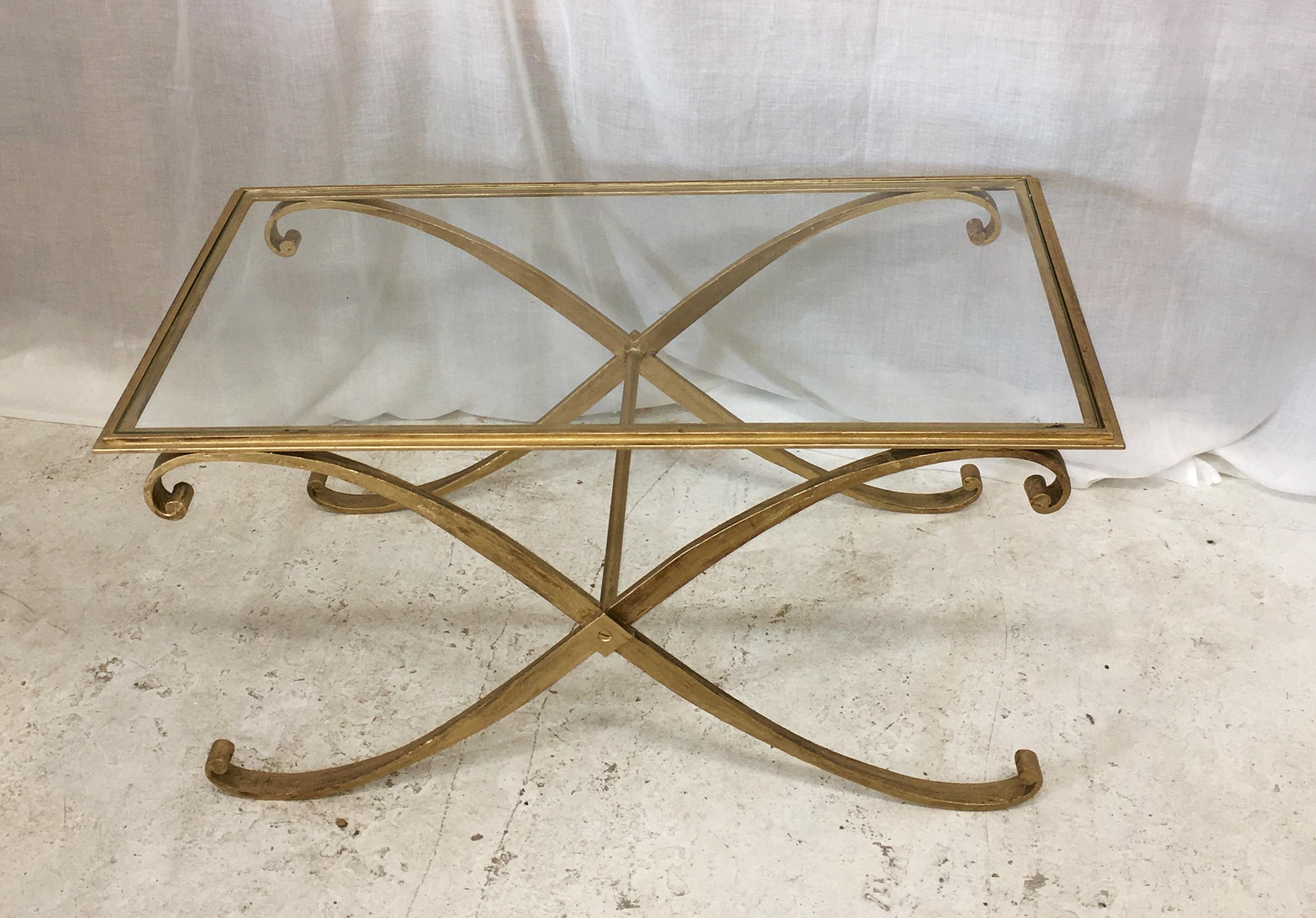 Great, elegant design by Raymond Subes for this coffee golden wrought iron table.
 