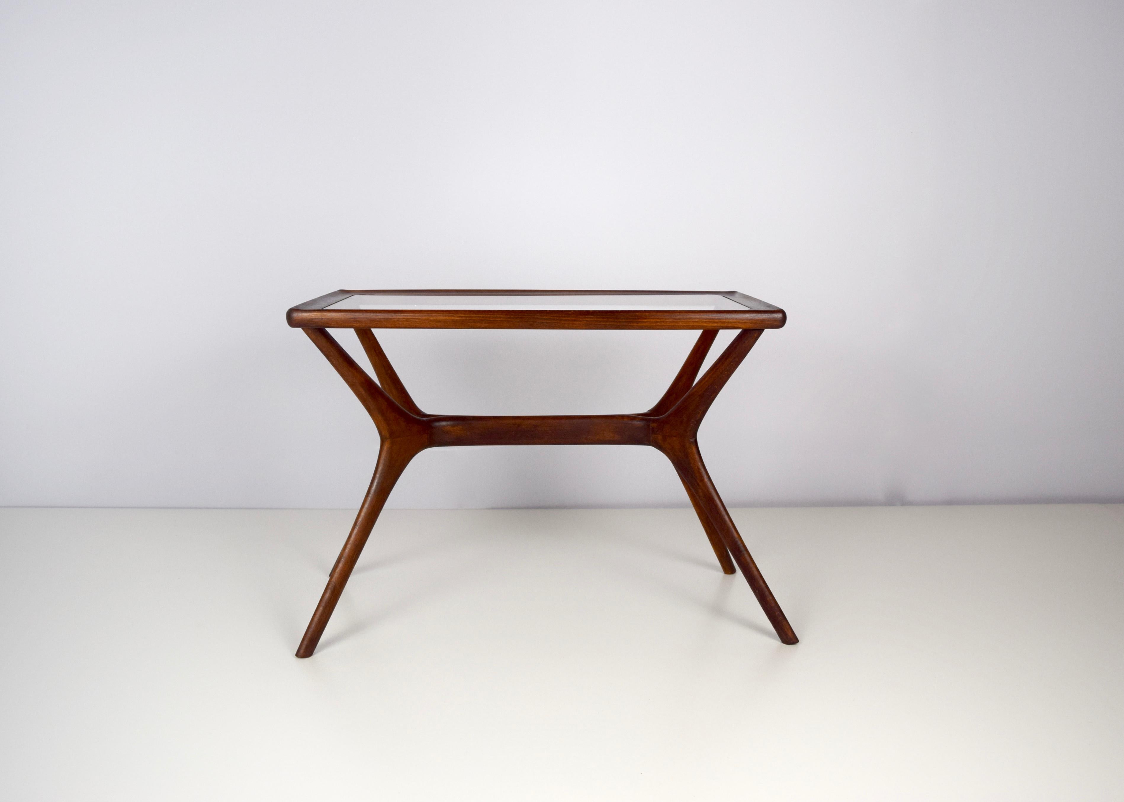 Beautiful original Italian midcentury design table from the 1950s, made of massive wood. It is in great condition, absolutely a top piece which elegantly fits with any style given its timeless design.

The table is 67.5 cm width, 37 cm deep and