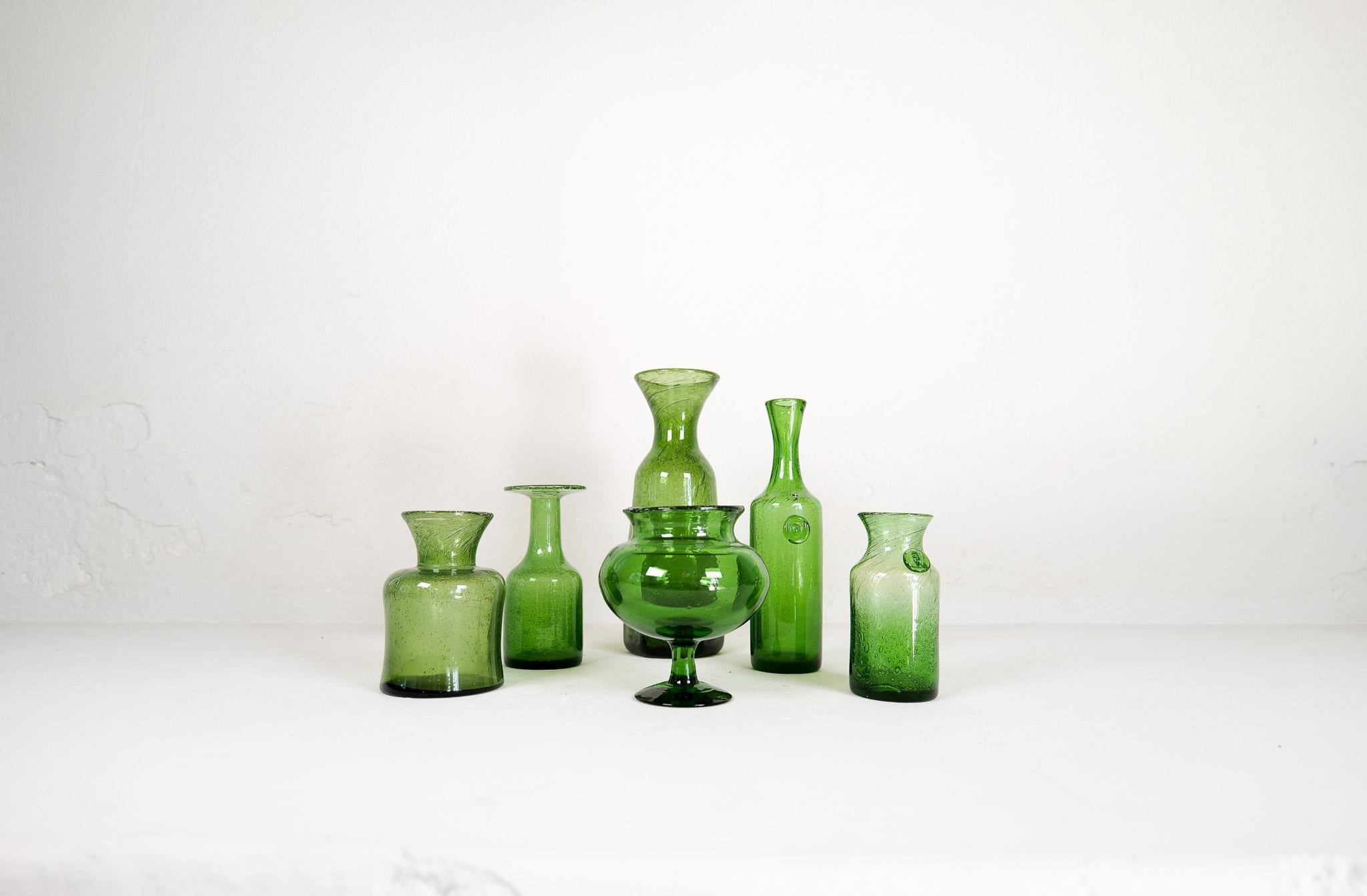 Collection of six green glass vases/vessels designed by Erik Höglund. Hand blown at Boda glass hut during the 1960s. They are all different sizes and shapes in very good to excellent condition. They are made in the typical method of Höglund where