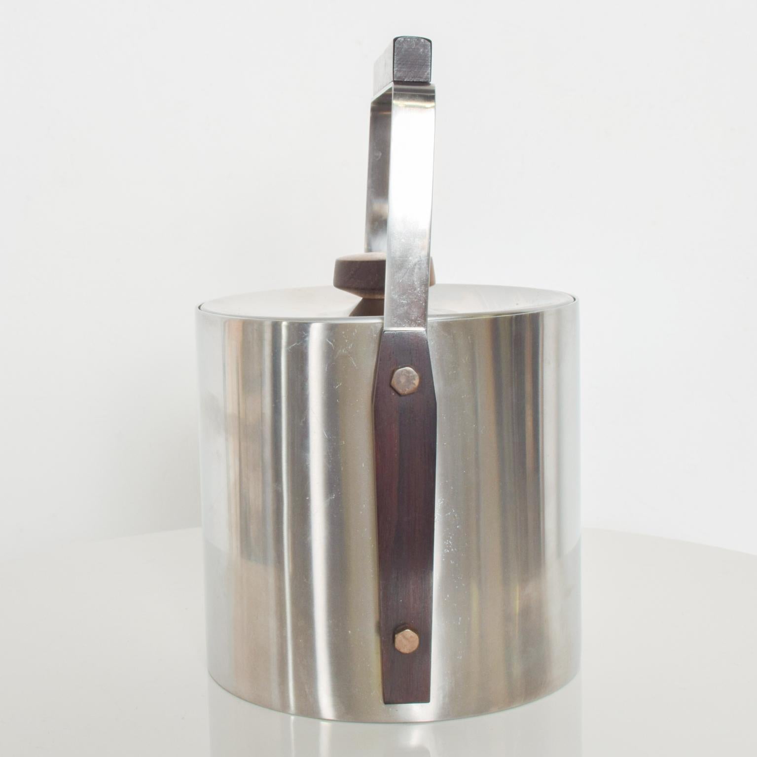 For your Pleasure: Vintage Barware Mid Century Modern CULTURA Ice Bucket in Stainless Steel with trim accents in Walnut Wood . Made in Sweden, 1960s.

Signed Cultura 18-8 Stainless Sweden. Heavy quality vintage piece.

Features convenient carry