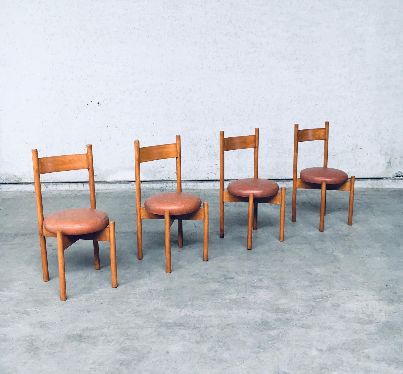 Vintage Midcentury Modern Design Dining Chair set of 4 in the Style of Charlotte Perriand 'Meribel' Model chairs. Made in France, 1960's period. Beech constructed chairs with a faux leather cushion for seat. The chairs have round legs with an X