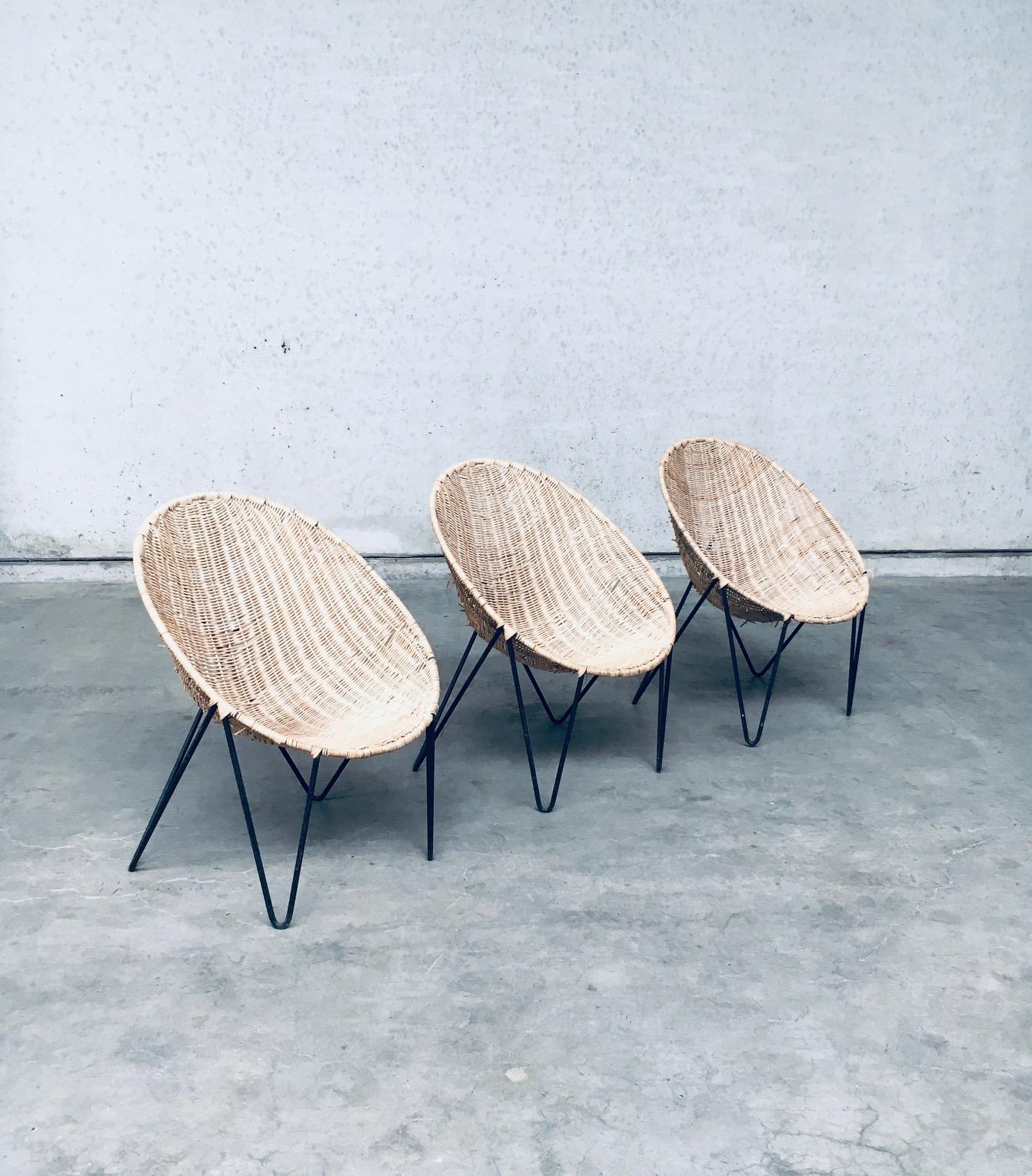 Vintage Midcentury Modern Italian Design 'EGG Basket' Wicker Chair set of 3. Made in Italy, 1950's period. In the style of Roberto Mango. Wicker / Rattan / Cane woven basket shape seats on tripod bend black metal frame. Very nice designed chairs